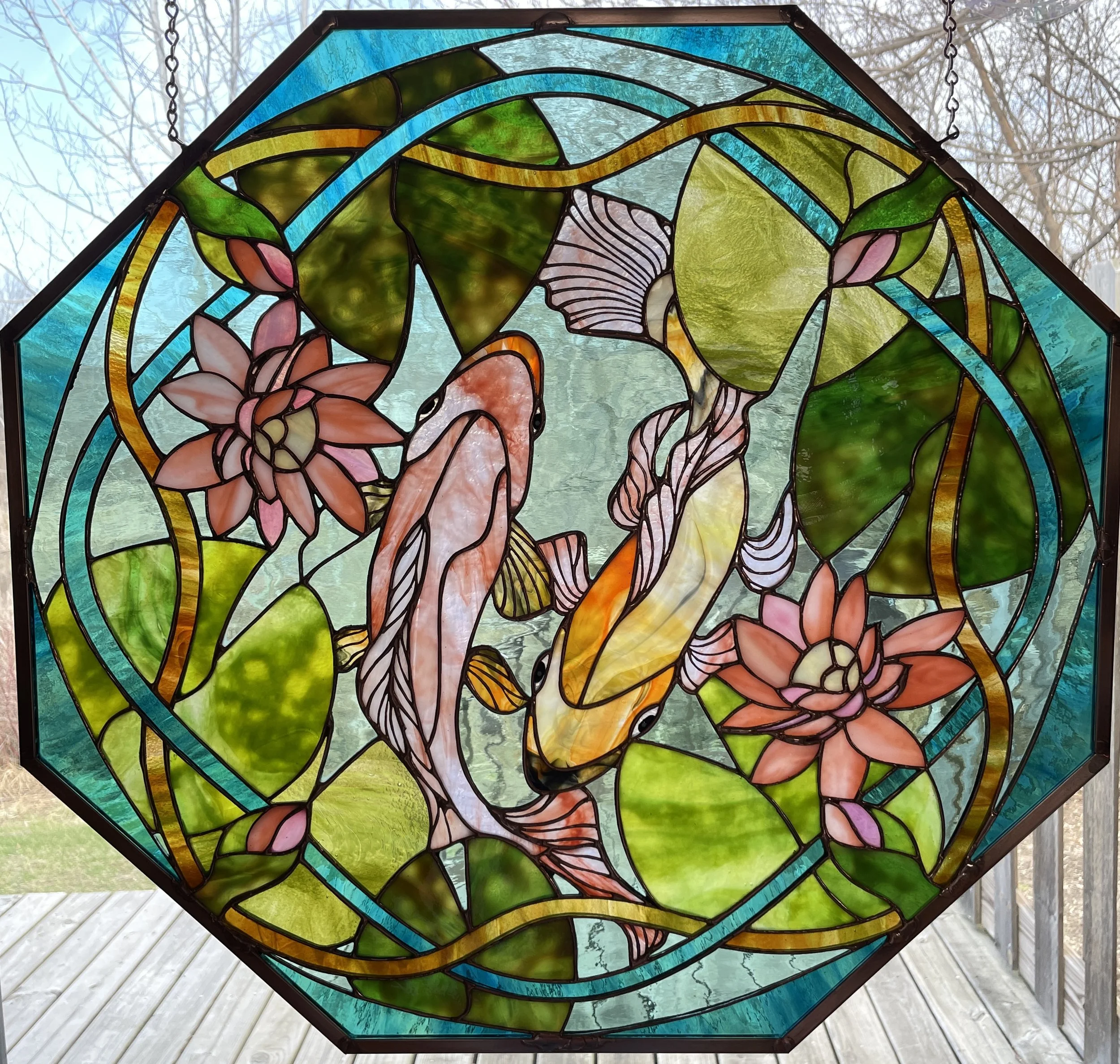 Reflections of Giverny  explores the quiet dialogue between light, water, flora, and fauna. Inspired by the atmosphere of Monet’s garden, as well as the Japanese koi pond at Lansing Community College, the composition brings koi, lotus flowers, and li