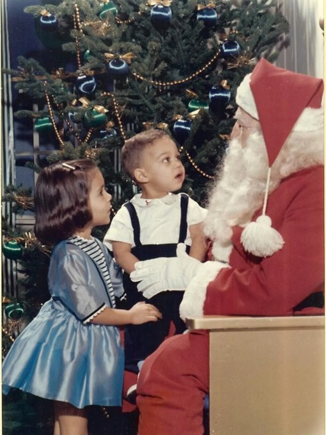 This is me and my brother, Aaron, in 1963. While I no longer make trips downtown to see Santa Claus, Christmas still brings me awe and wonder. May your day be filled with peace and joy, and may you be surrounded by loved ones this holiday season.