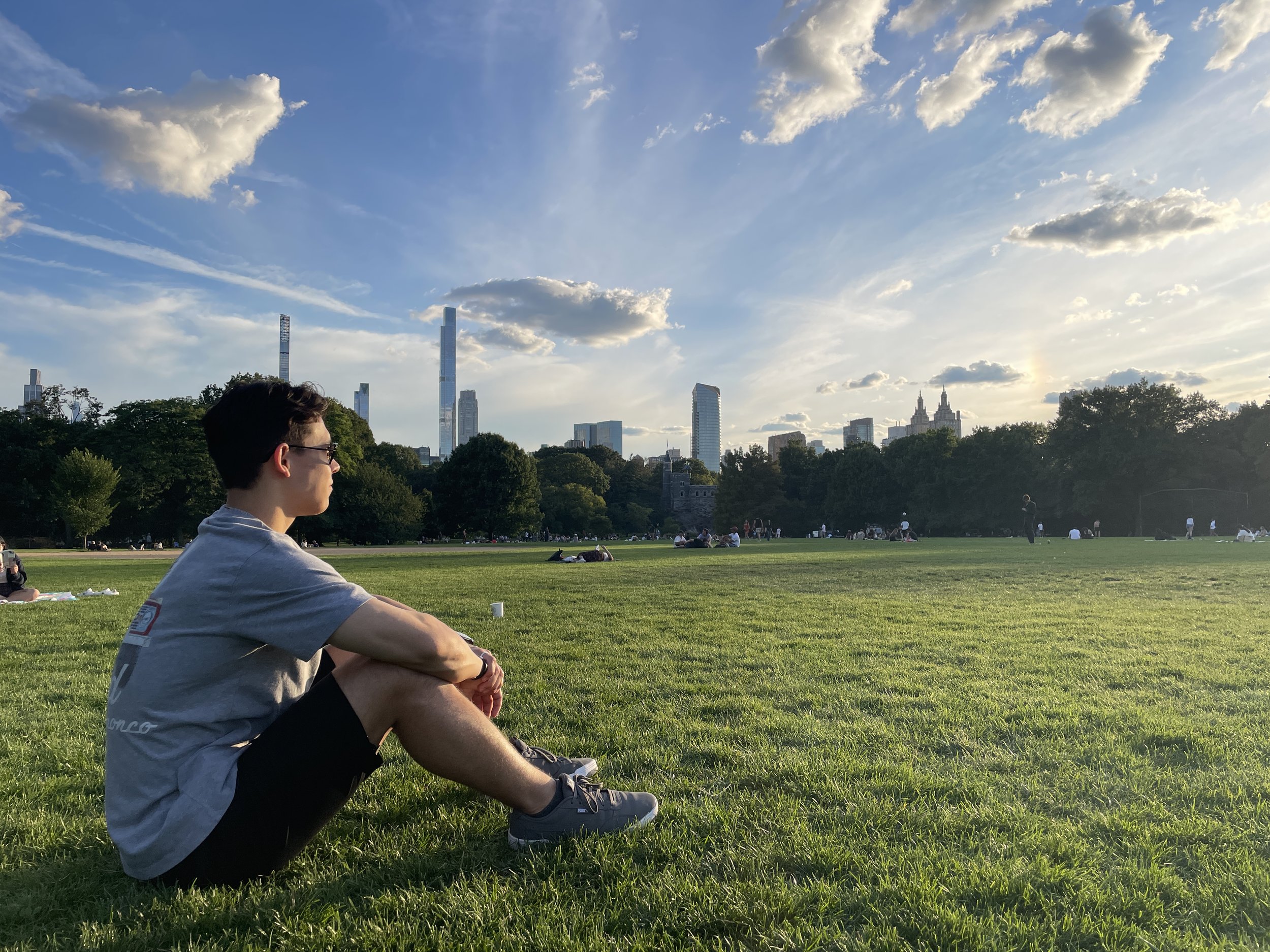 A young man sits at Central Park. Sept 2025.