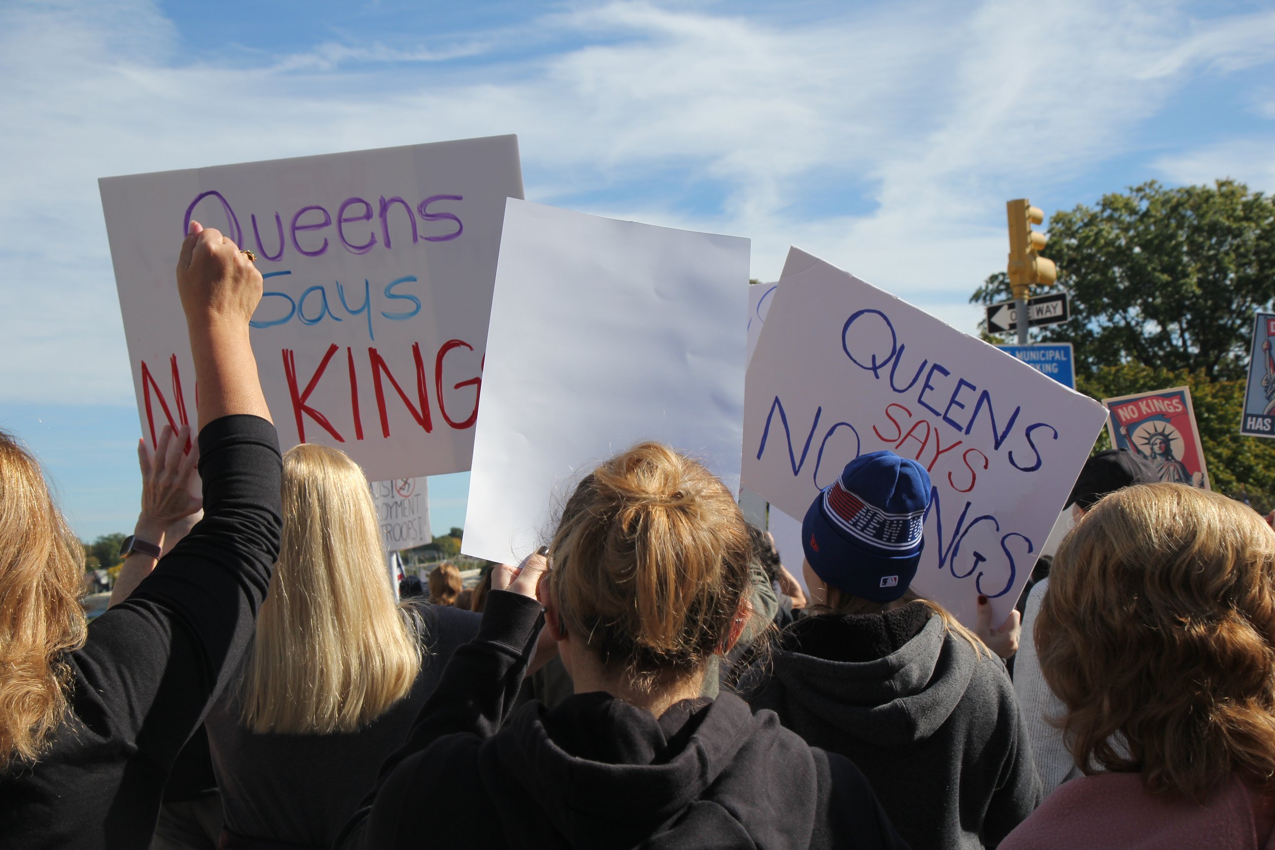 Protestors gather at a No Kings rally in Forest Hills, Queens. Oct 2025