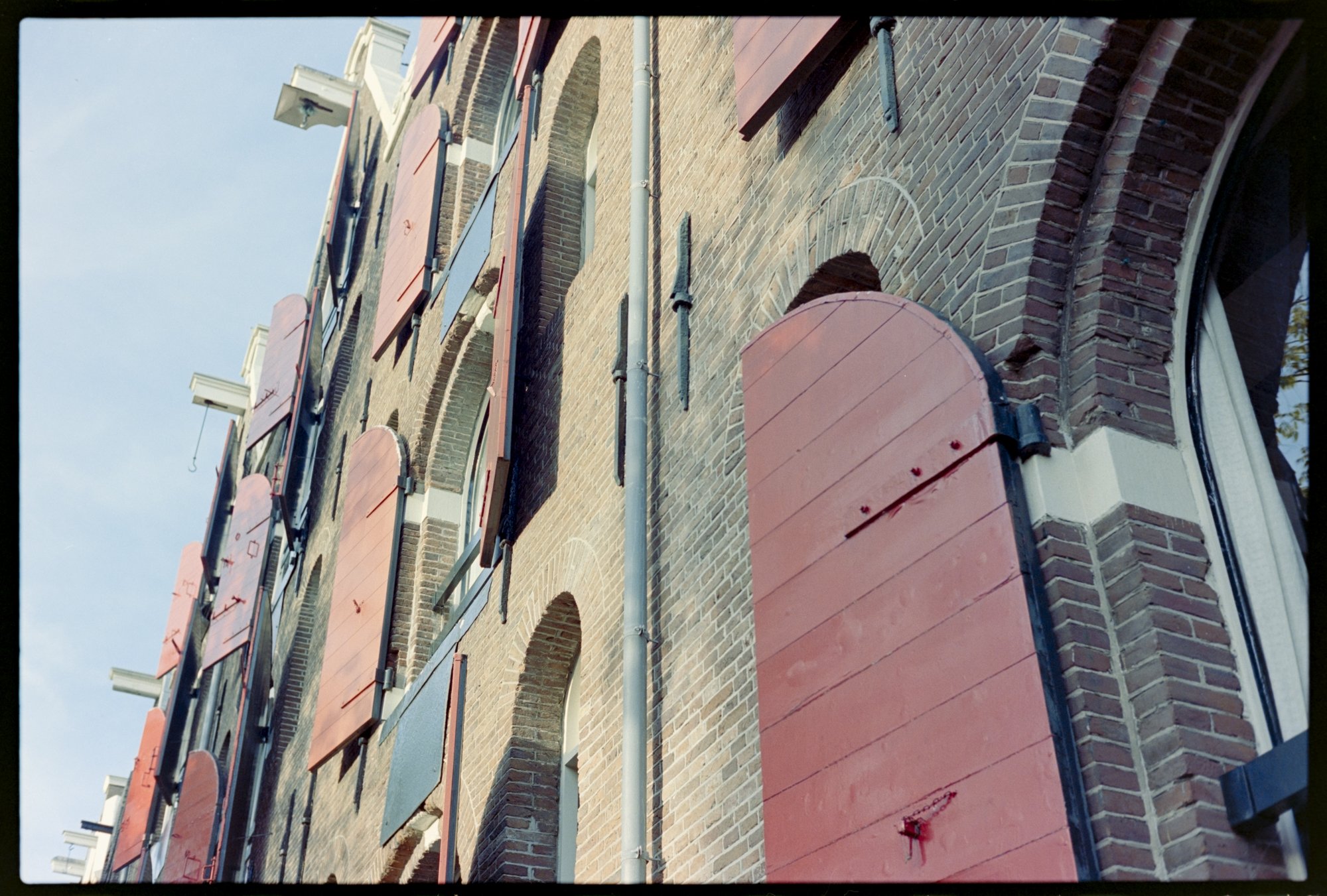 Shutters adorn the exterior of a building in Amsterdam.