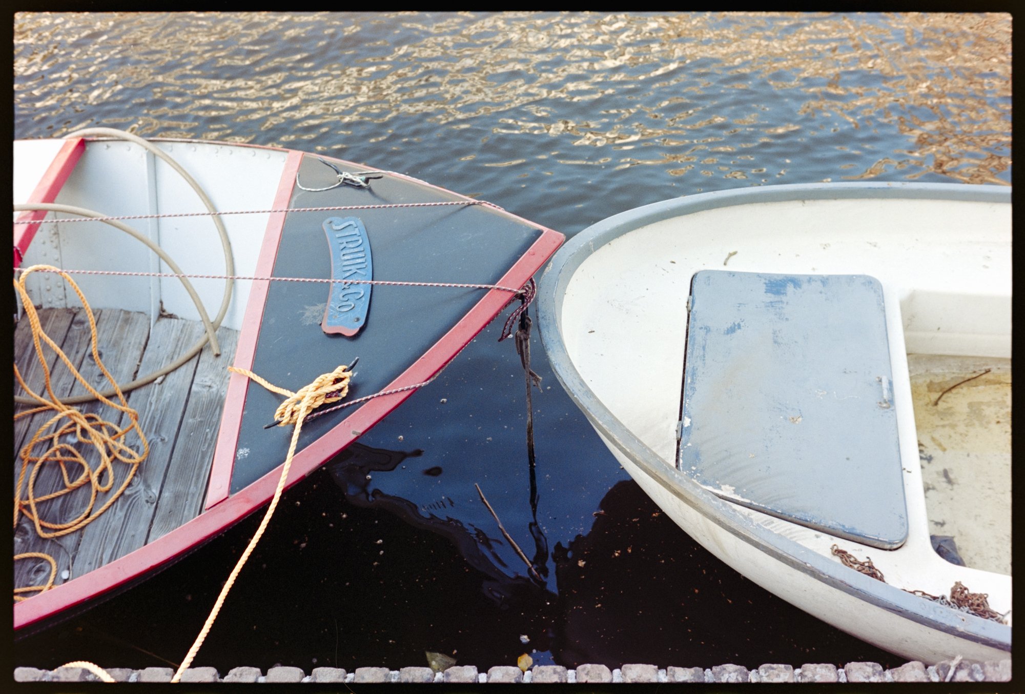 Two boats docked in the canal in Alkmaar, the Netherlands.