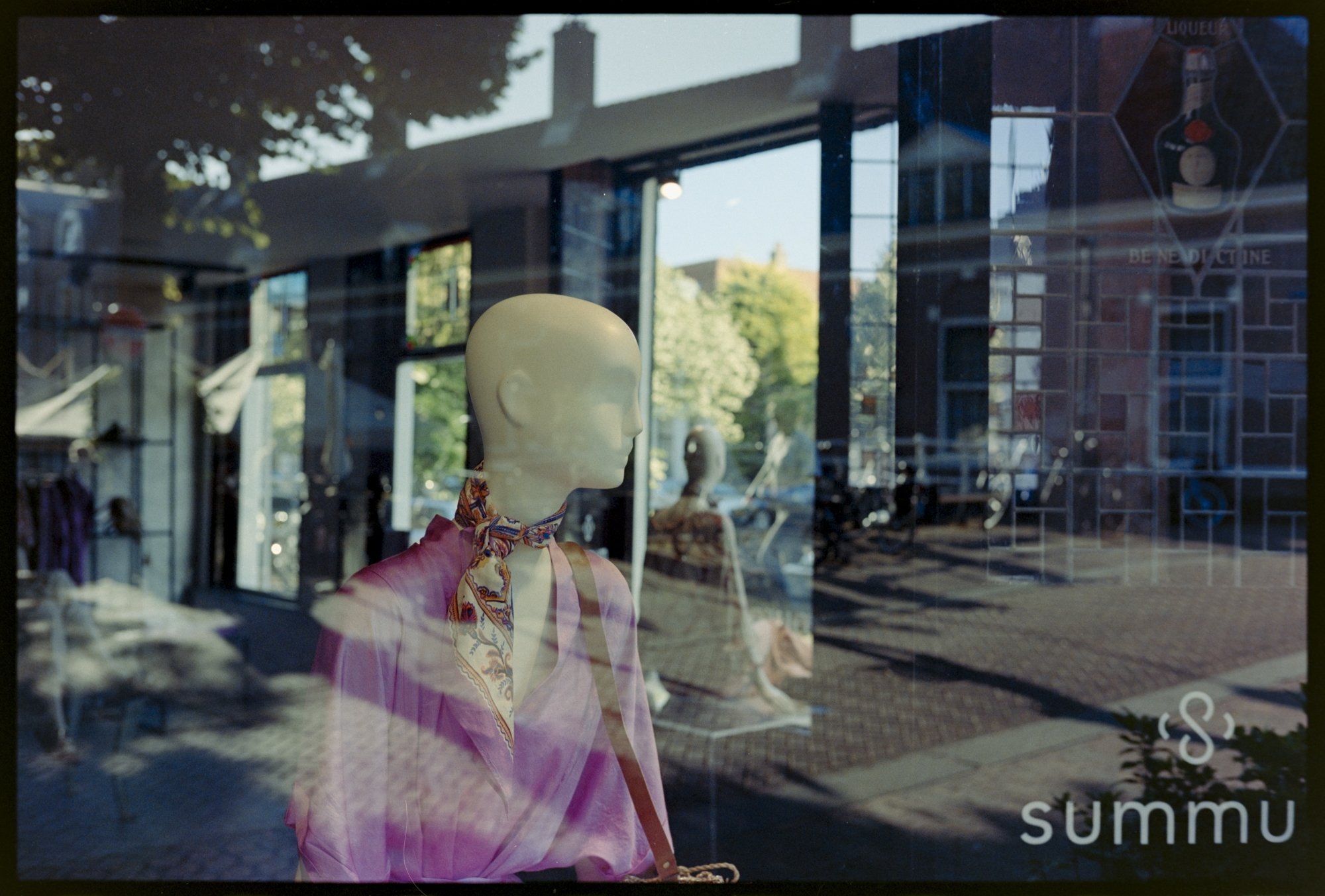Reflections in the window of a closed shop.