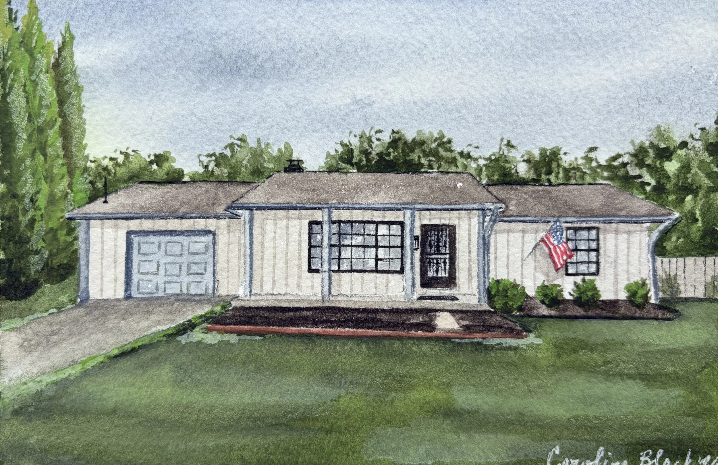 Watercolor painting of a single-story house with a gray roof, white siding, black-framed windows, and a front door. There is an American flag hanging near the door, surrounded by green shrubs and tall trees, with a high hedge on the left side. The sk