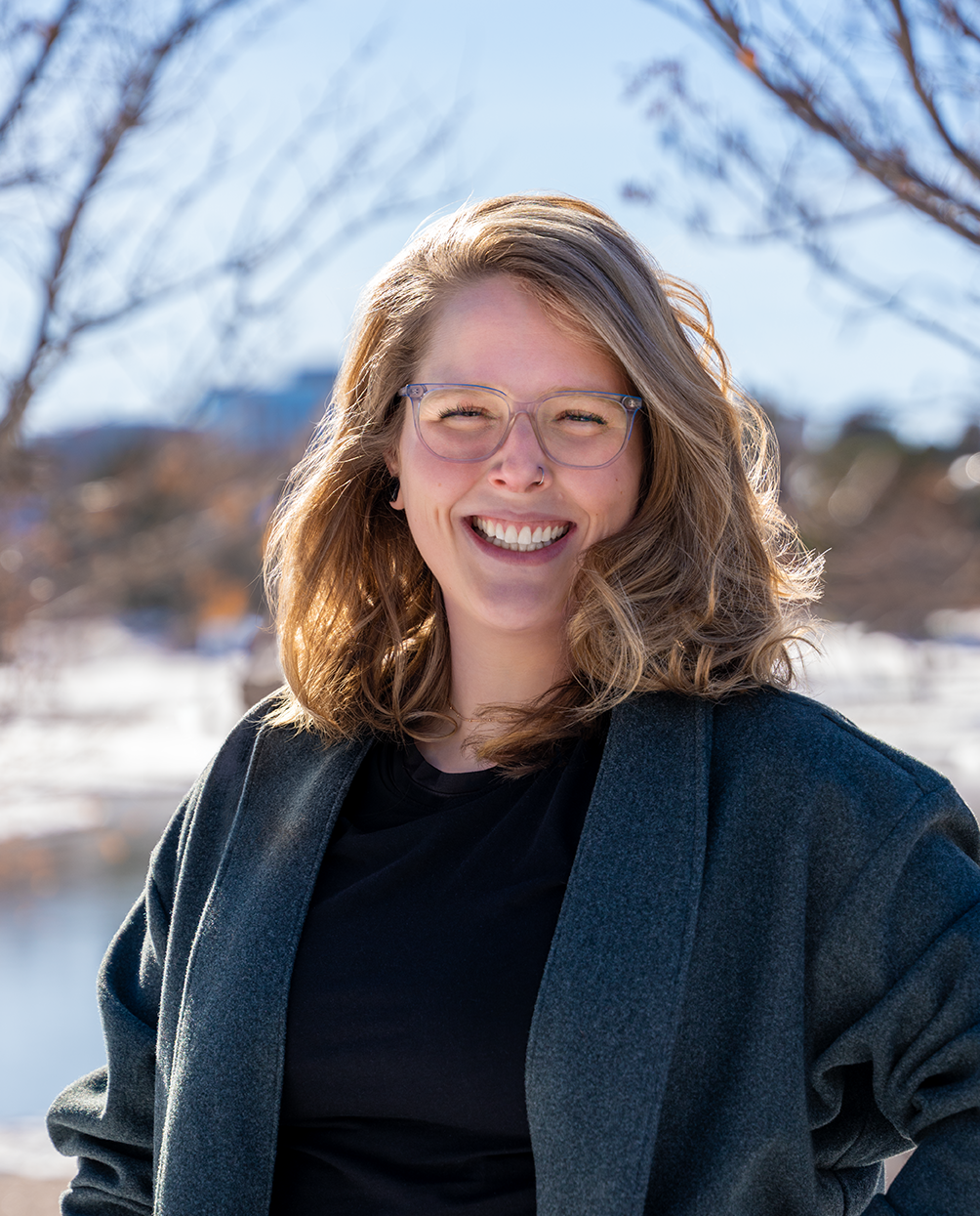Licensed Therapist Danika Schmitz MA, LPC smiling outside in the winter