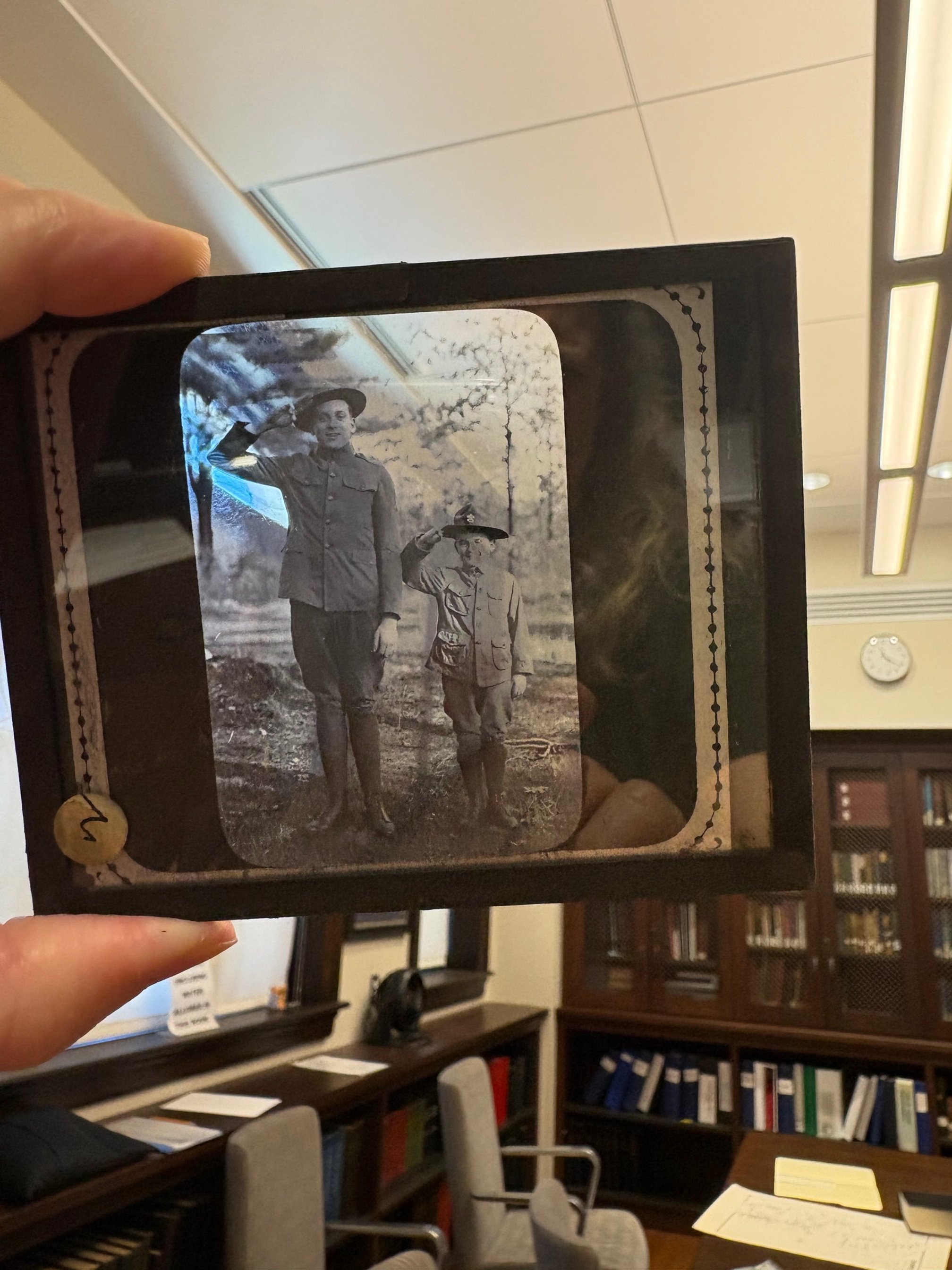 Reading Boy Scouts on a lantern slide.