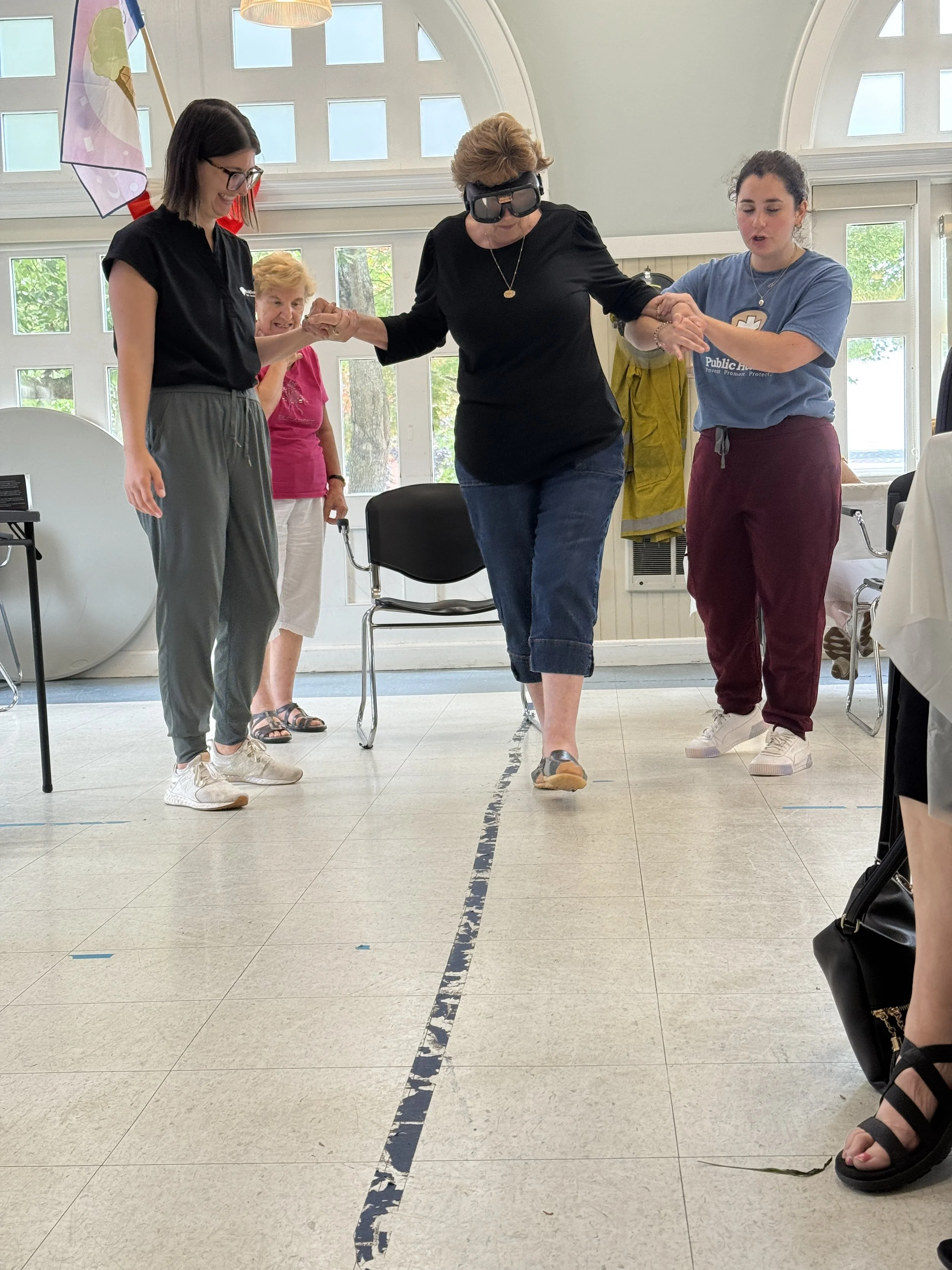 Drunk goggle simulation with the participant walking a striaght line with assistance.