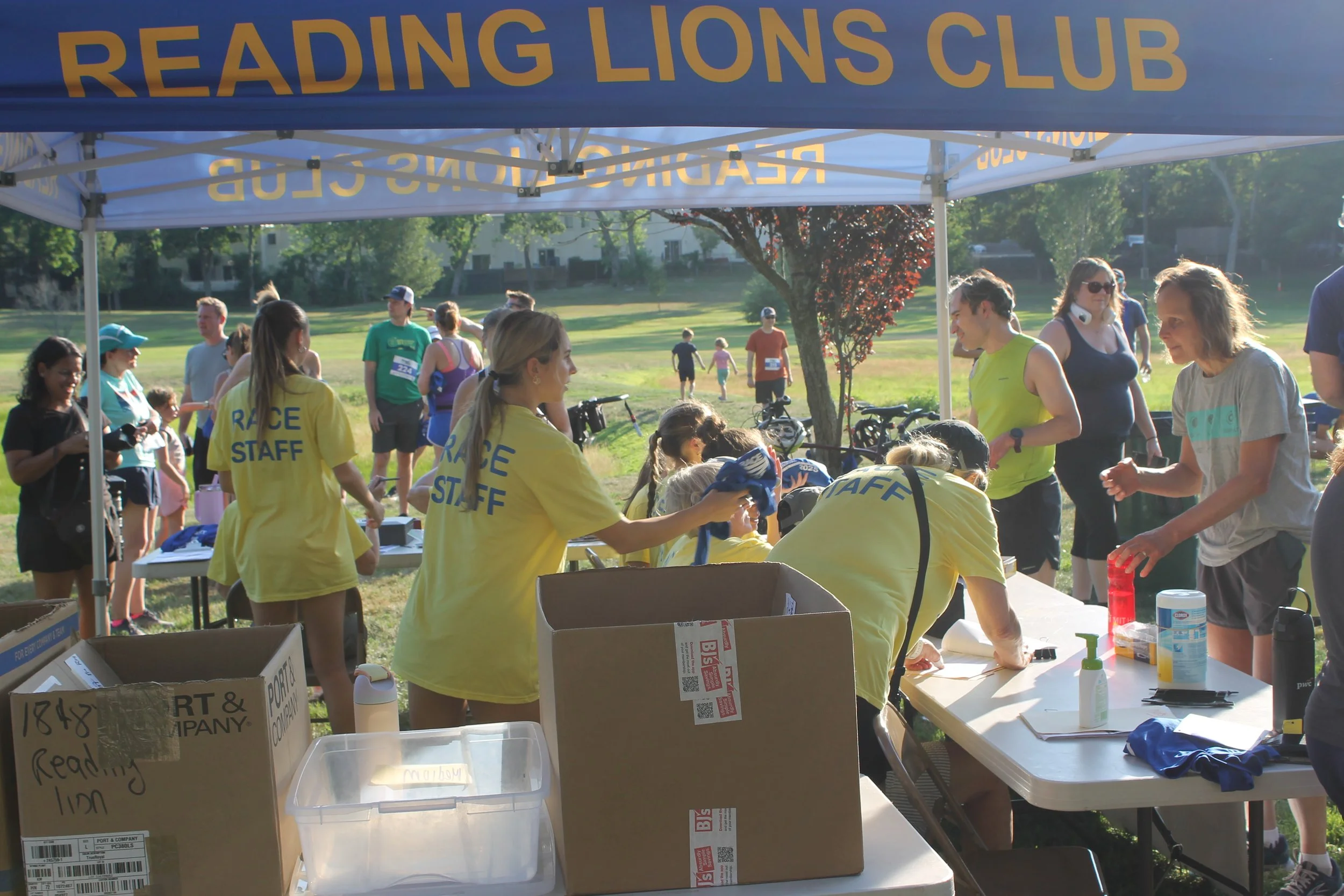 Participants at the registration table preparing for the race.