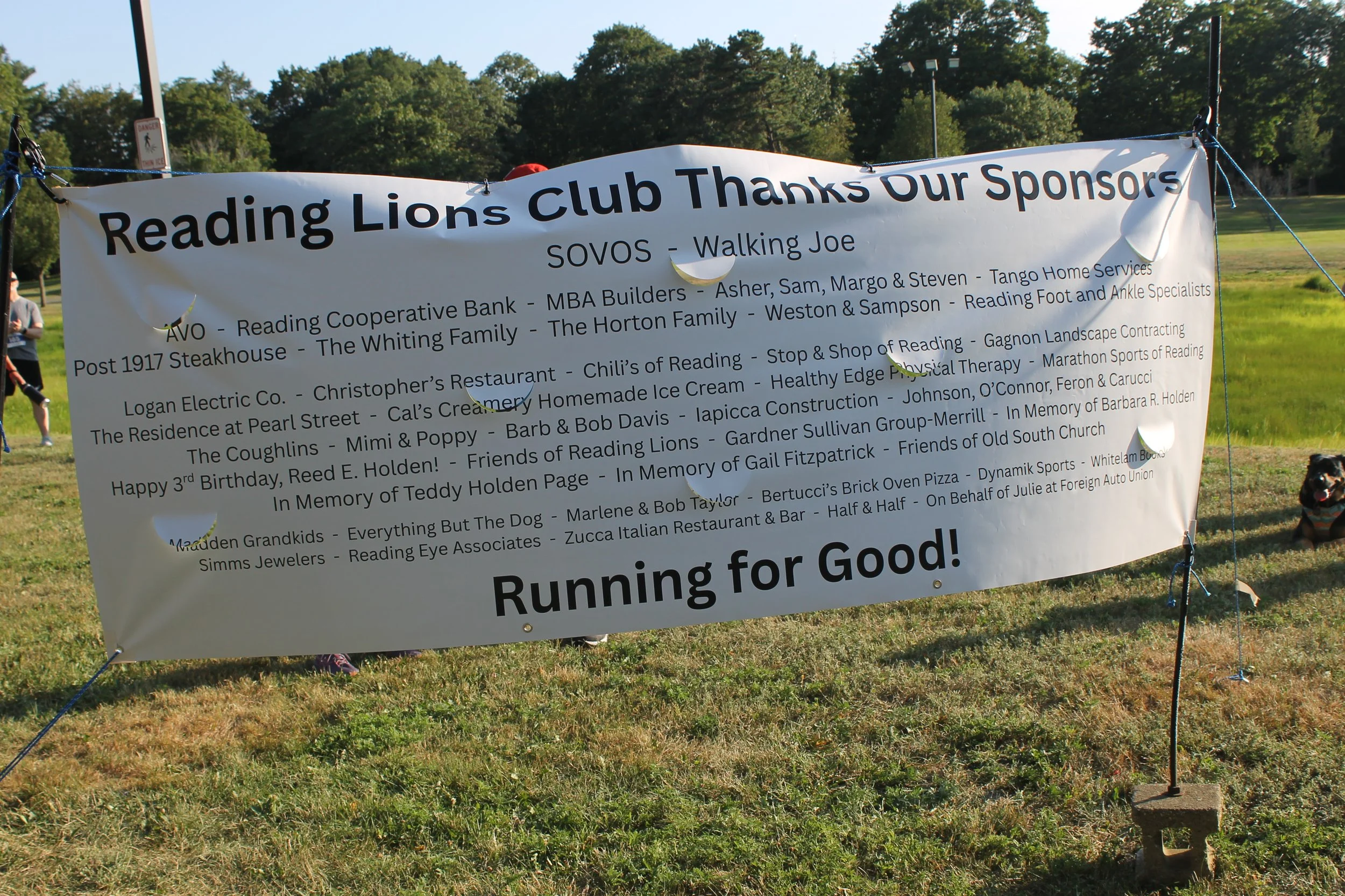 Sponsors of the Journey for Sight 5K race/1-Mile Walk listed on a banner.