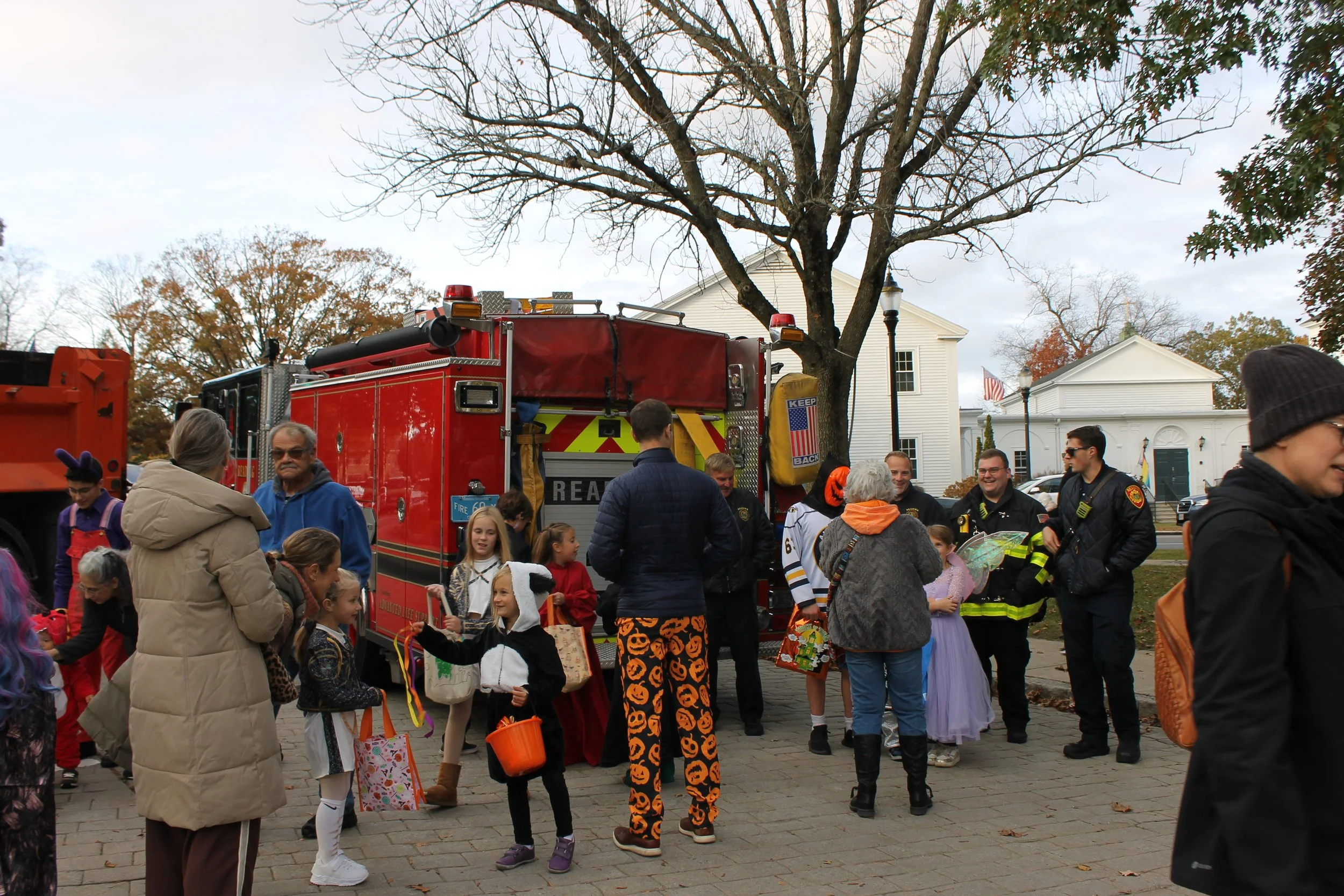 Families along the Common during downtown trick-or-treat.