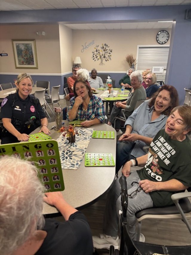Officer Balboa, and residents (l-r) Regina Gomez, Denise Lawrence and Karen Turenne.