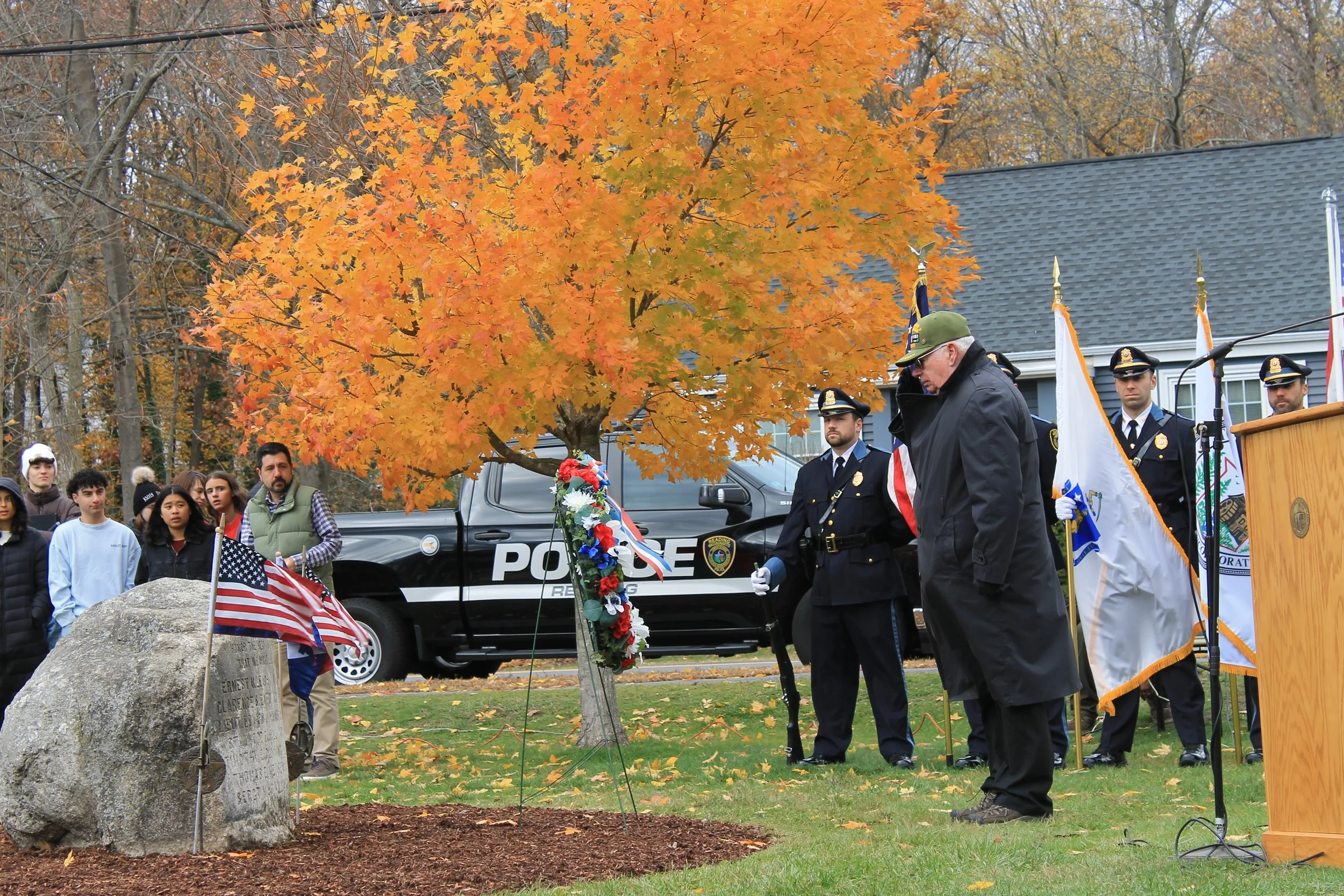 Veterans Services Officer Will Valliere standing at attention after placing the wreath at the Veterans Day Ceremony at Memorial Park.