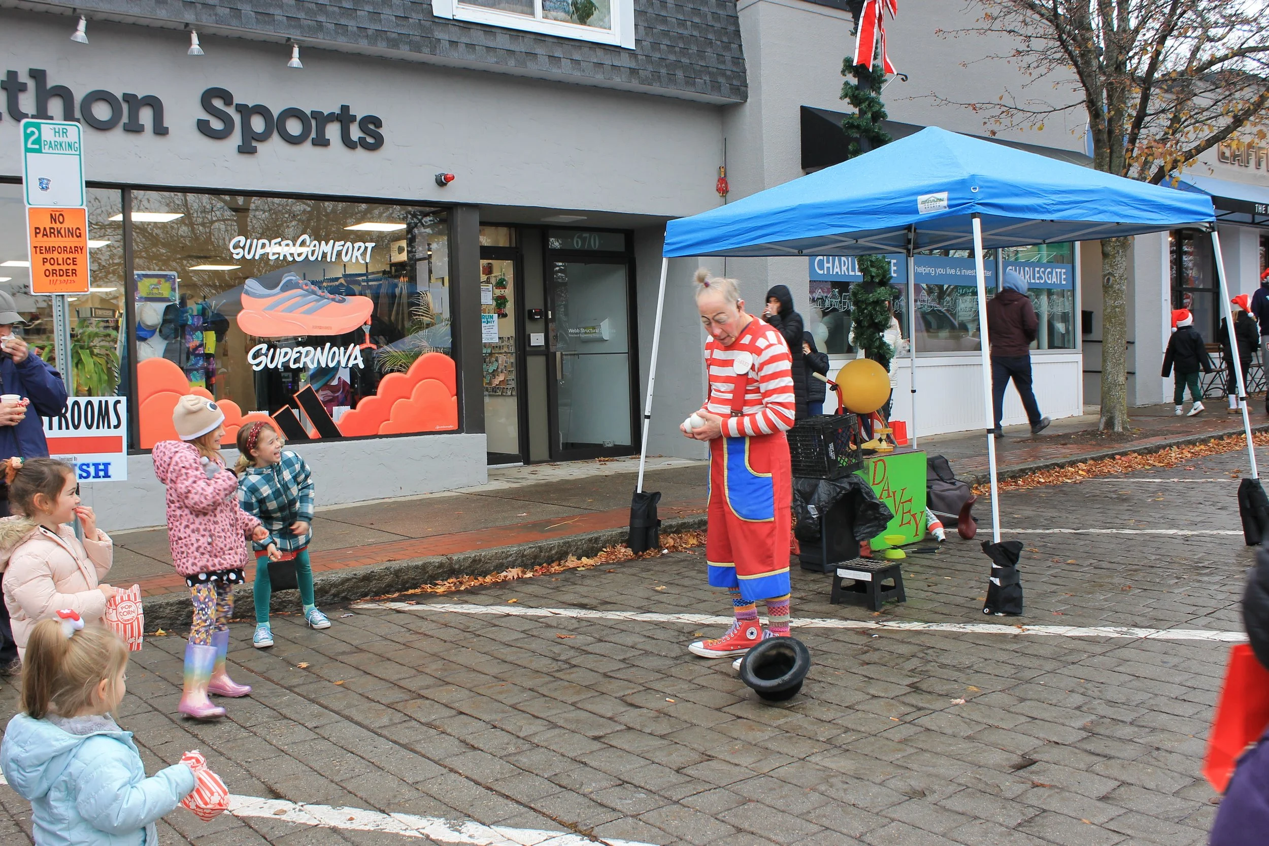 Davey the Roaming Performer entertaining a crowd at the Tree Lighting Ceremony on the Town Common.