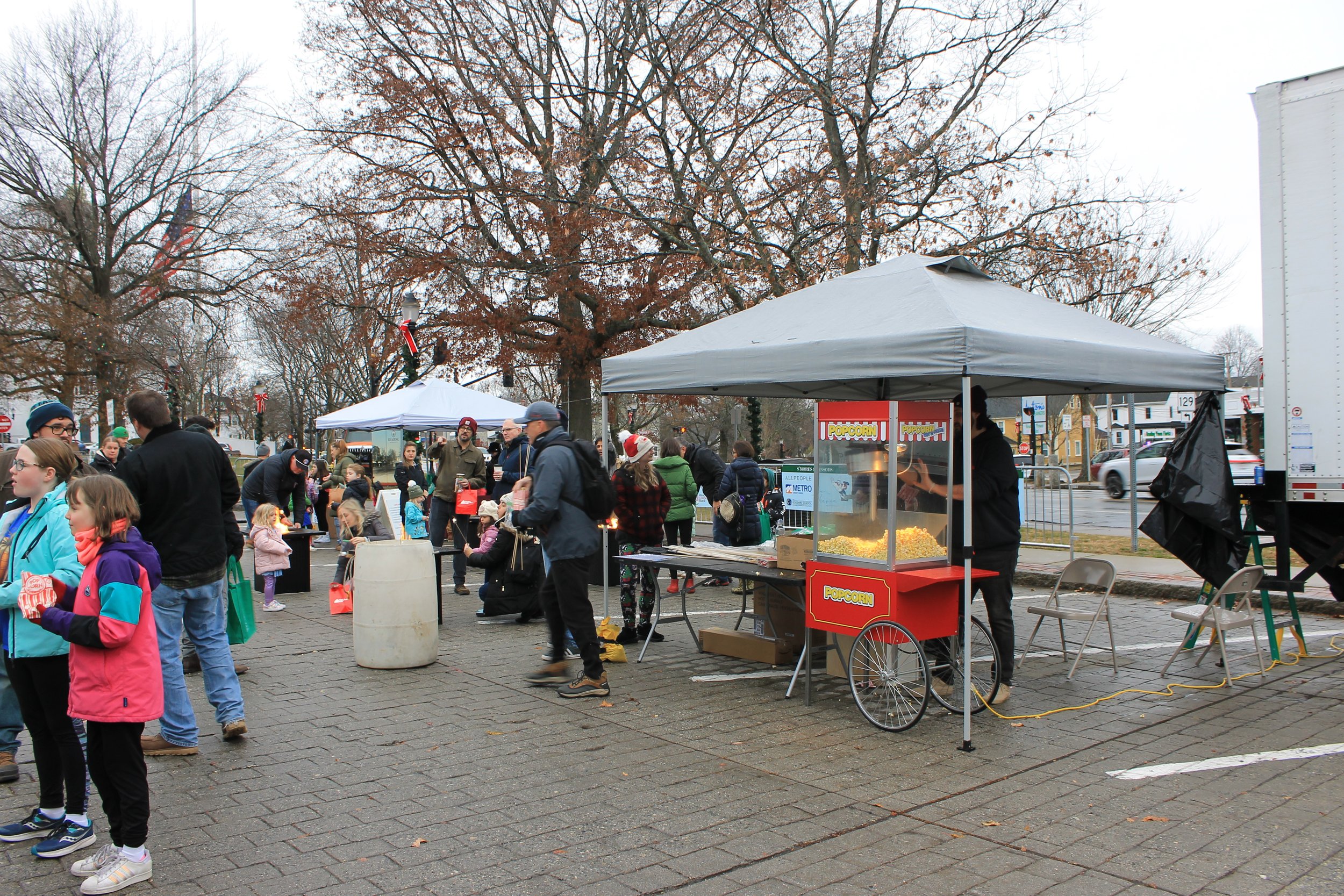 Doyon's Appliances handing out popcorn to patrons at the Tree Lighting Ceremony on the Town Common.