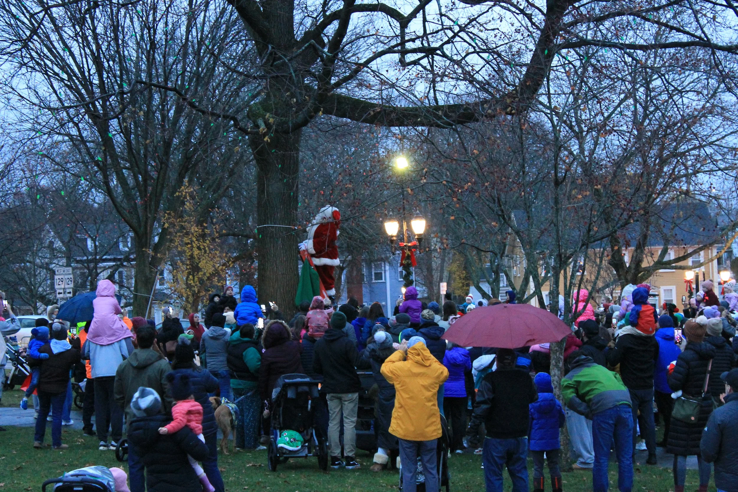 Santa Claus preparing to light the trees at the Tree Lighting Ceremony on the Town Common.