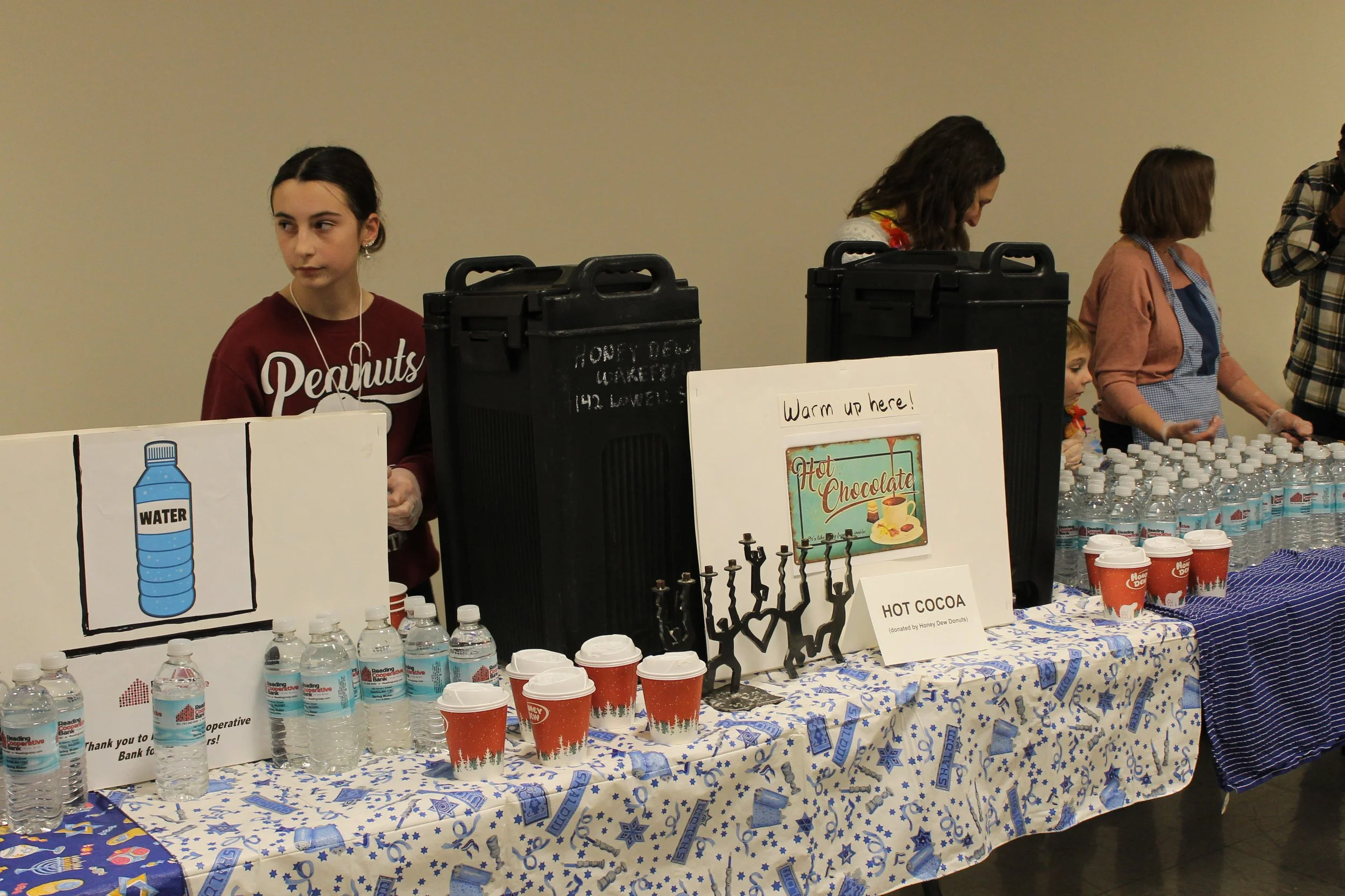 Hot chocolate and water available for attendees after the program at the Menorah Lighting.