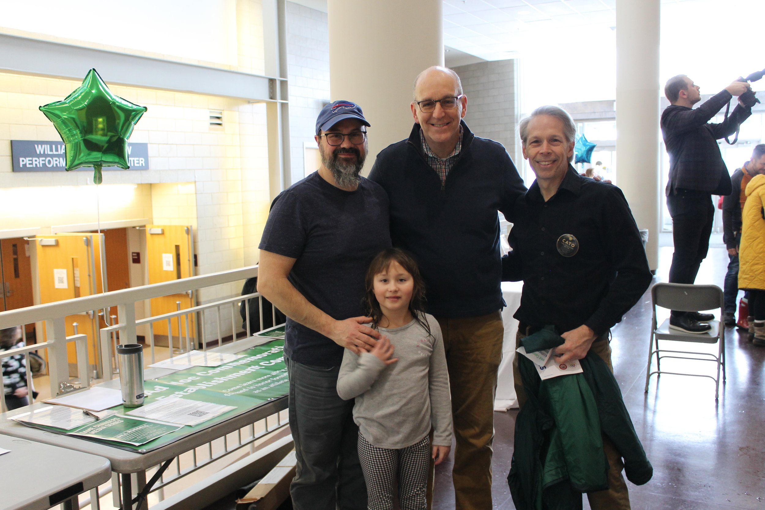 Members of Reading's ACE Committee stand by their information table during the Martin Luther King Jr. Day program at RMHS.