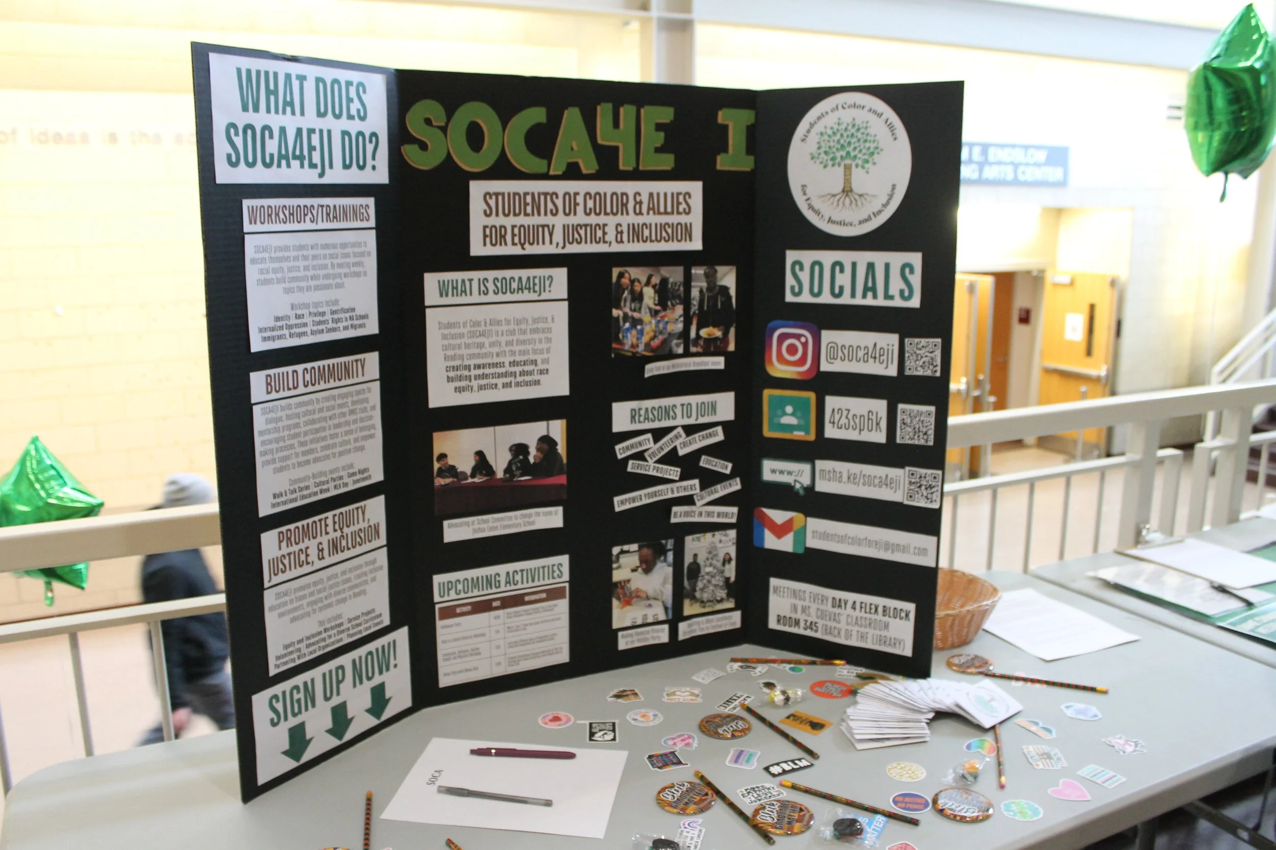 Students from SOCA4EJI host an information table during Reading's Martin Luther King Jr. Day program at RMHS.
