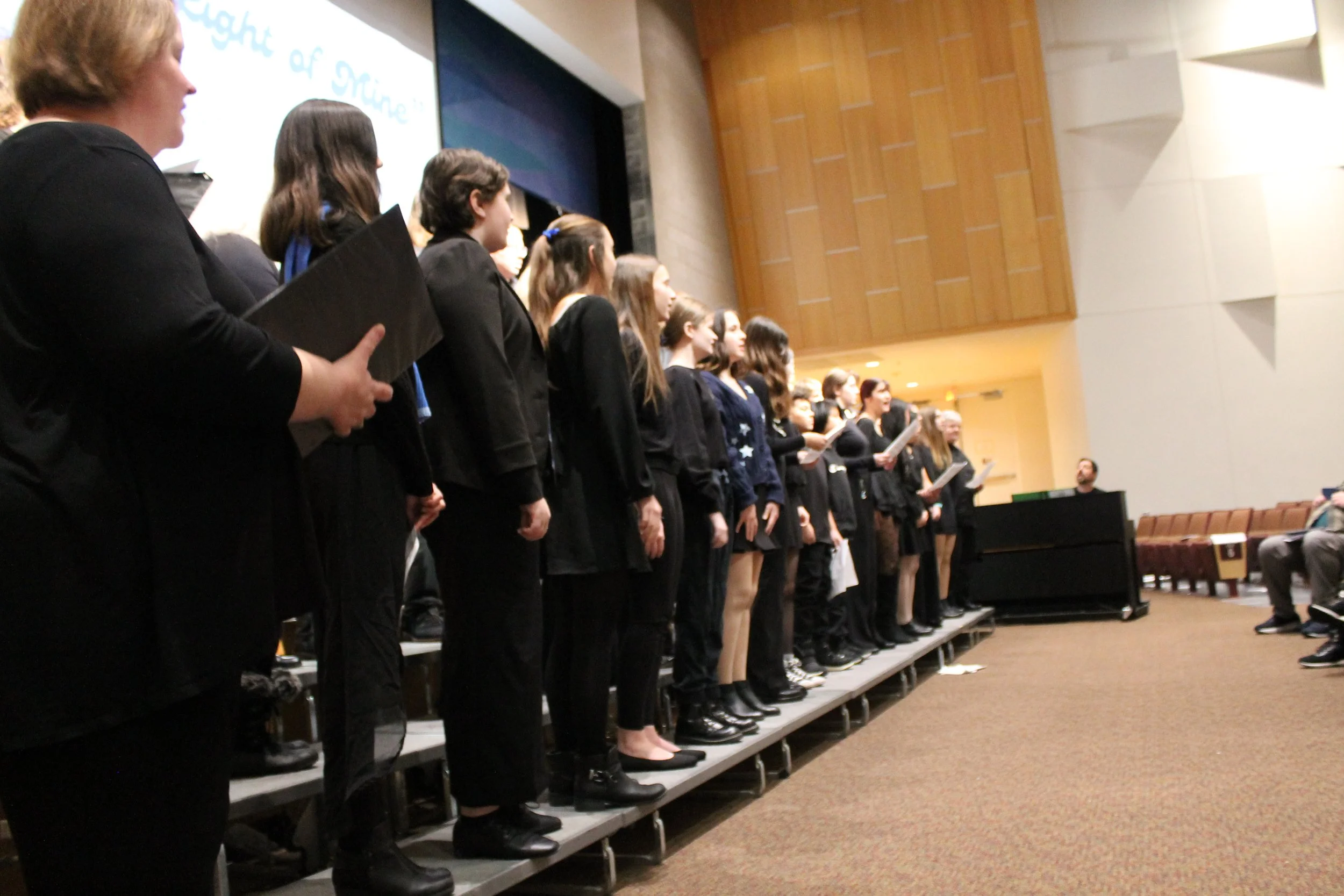 The Ipswich Community Chorus performs We Resist during Reading's MLK Jr. Day program at RMHS.