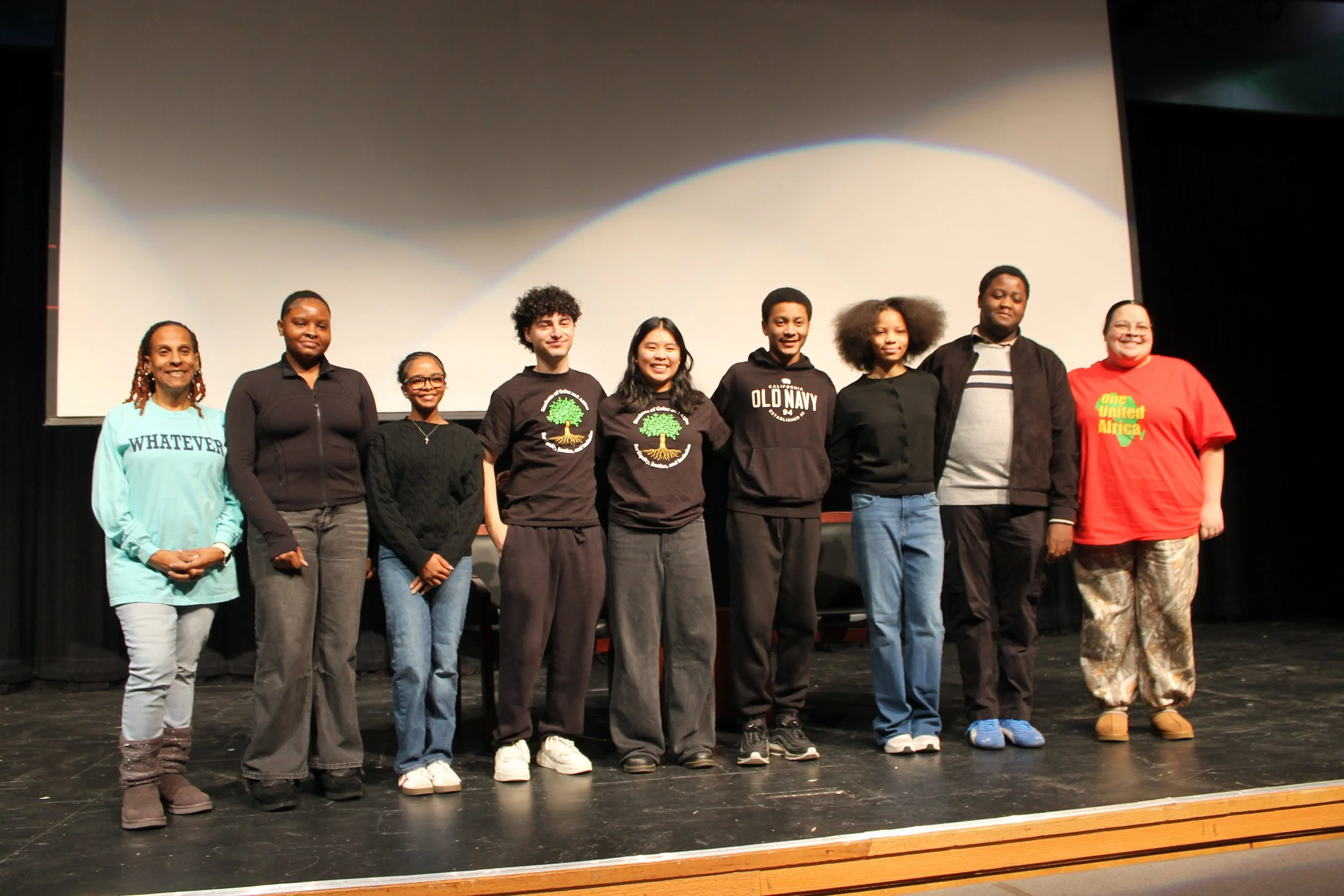 SOCA Students pose with advisors Sherilla Lastrade and ANna Cuevas during Reading's MLK Jr. Day program at RMHS.