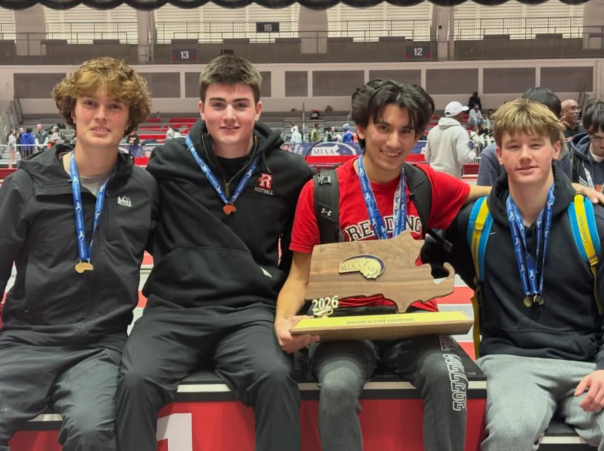 RMHS athletes posing with the trophy following the MIAA Division 3 State Track Championships.