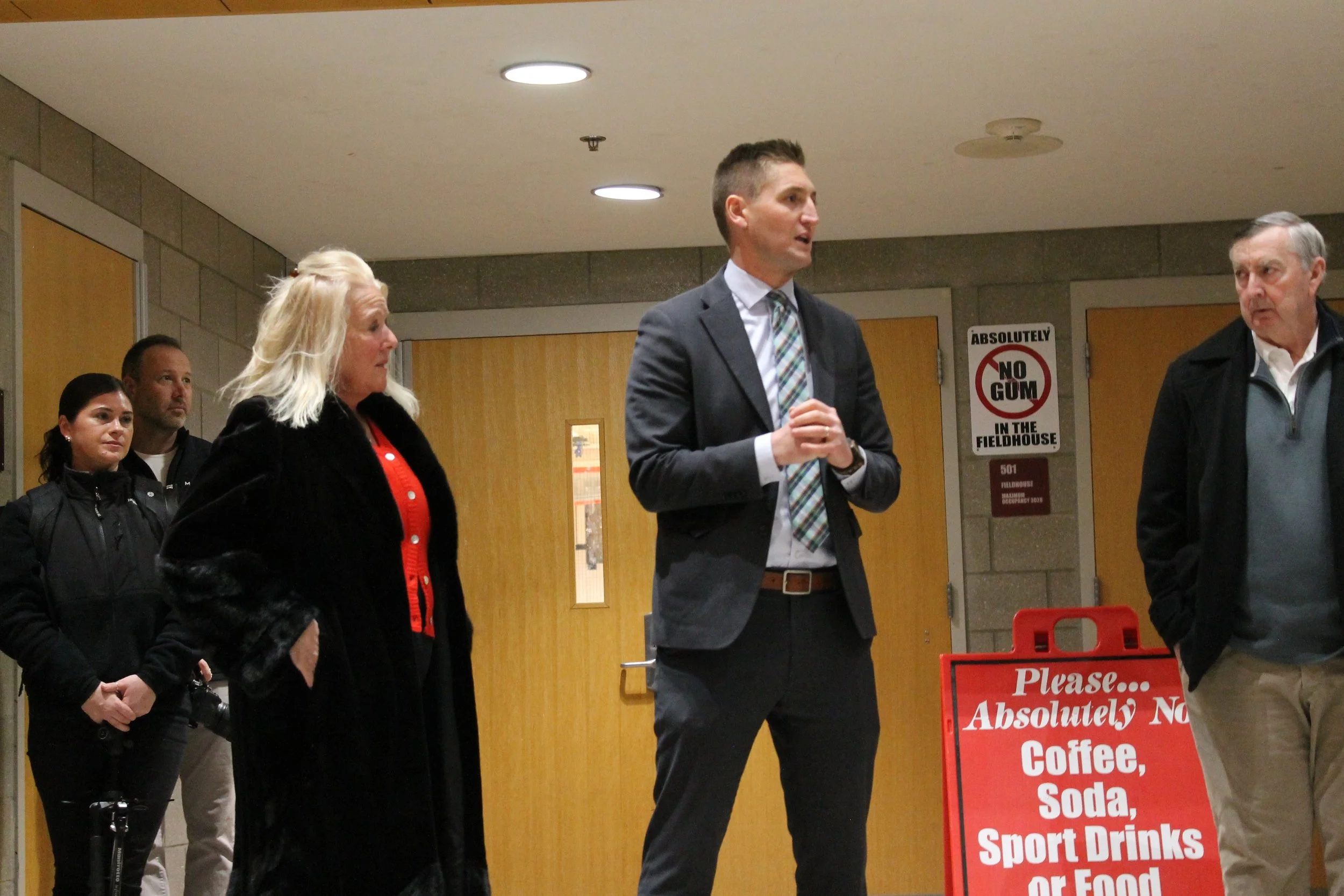 Supt. Dr. Tom Milaschewski (right) delivers remarks alongside fonor Claudia Miksen (right) at the RMHS Fieldhouse ribbon-cutting ceremony.