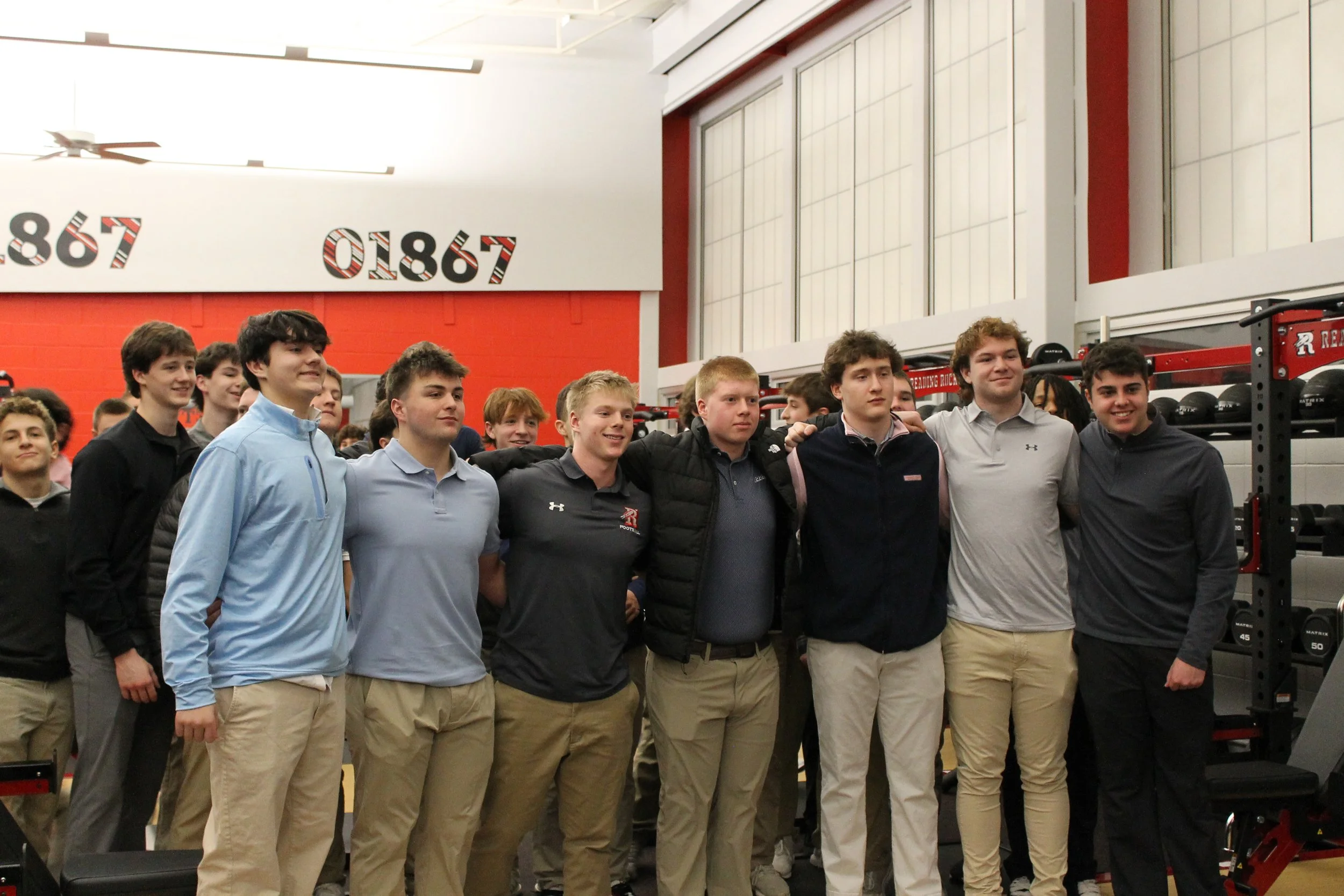 RMHS football players pose in the newly renovated weight room, grateful for the community investment that made it possible.