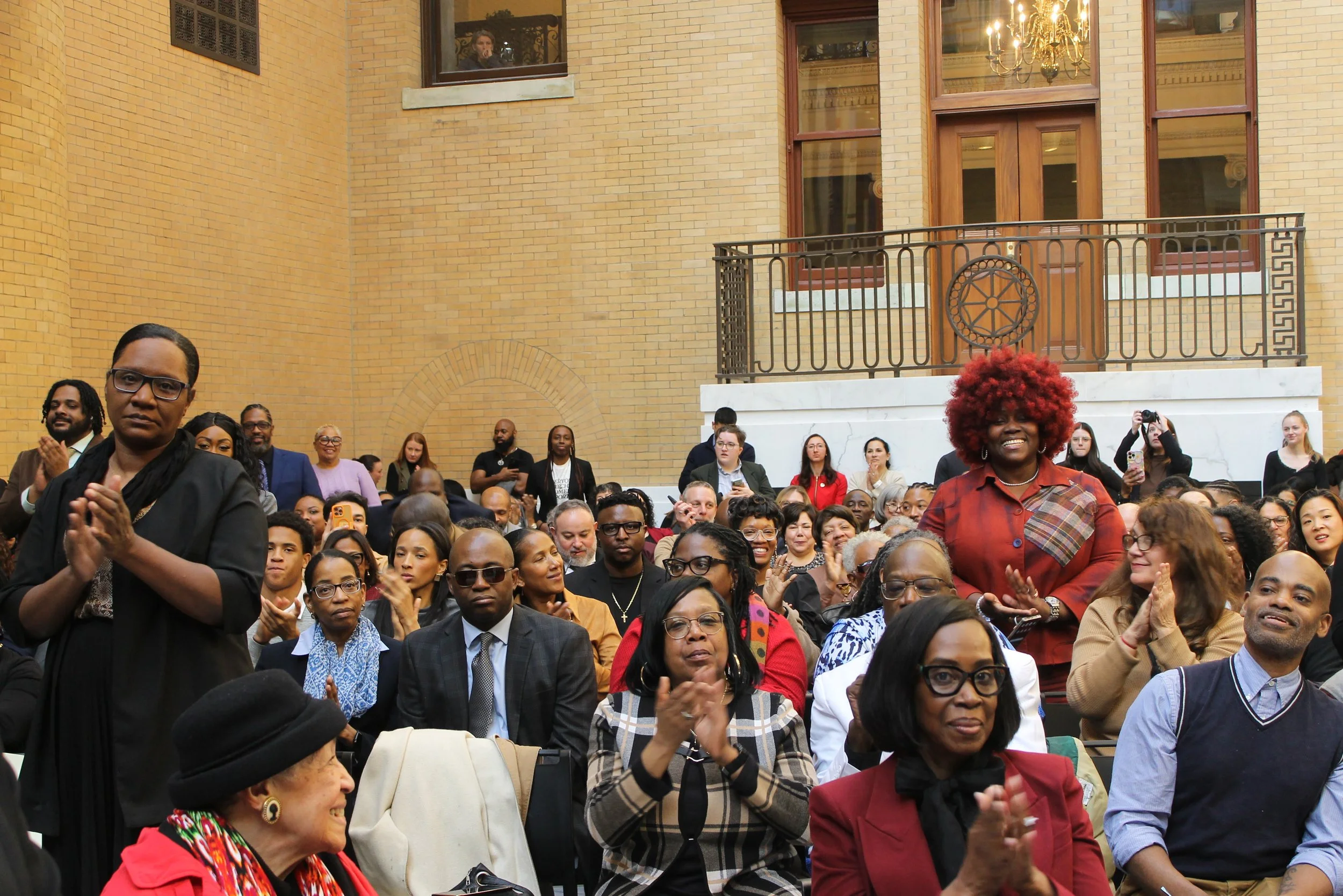 Audience members applaud during the program recognizing Black leaders and changemakers from across Massachusetts.