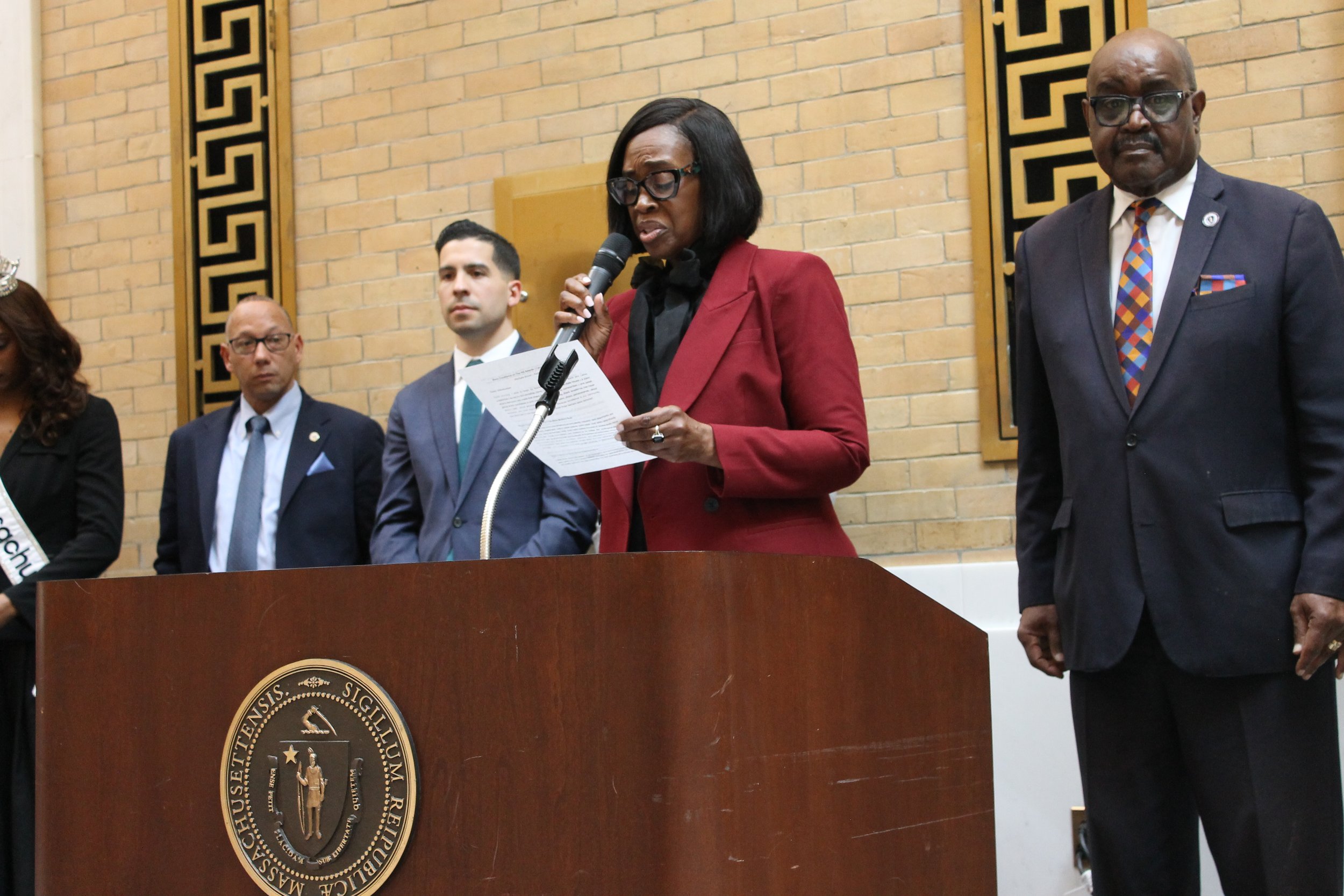 Michelle Brown of The Juice Foundation reads prepared remarks during the recognition ceremony honoring Black excellence and community leadership.
