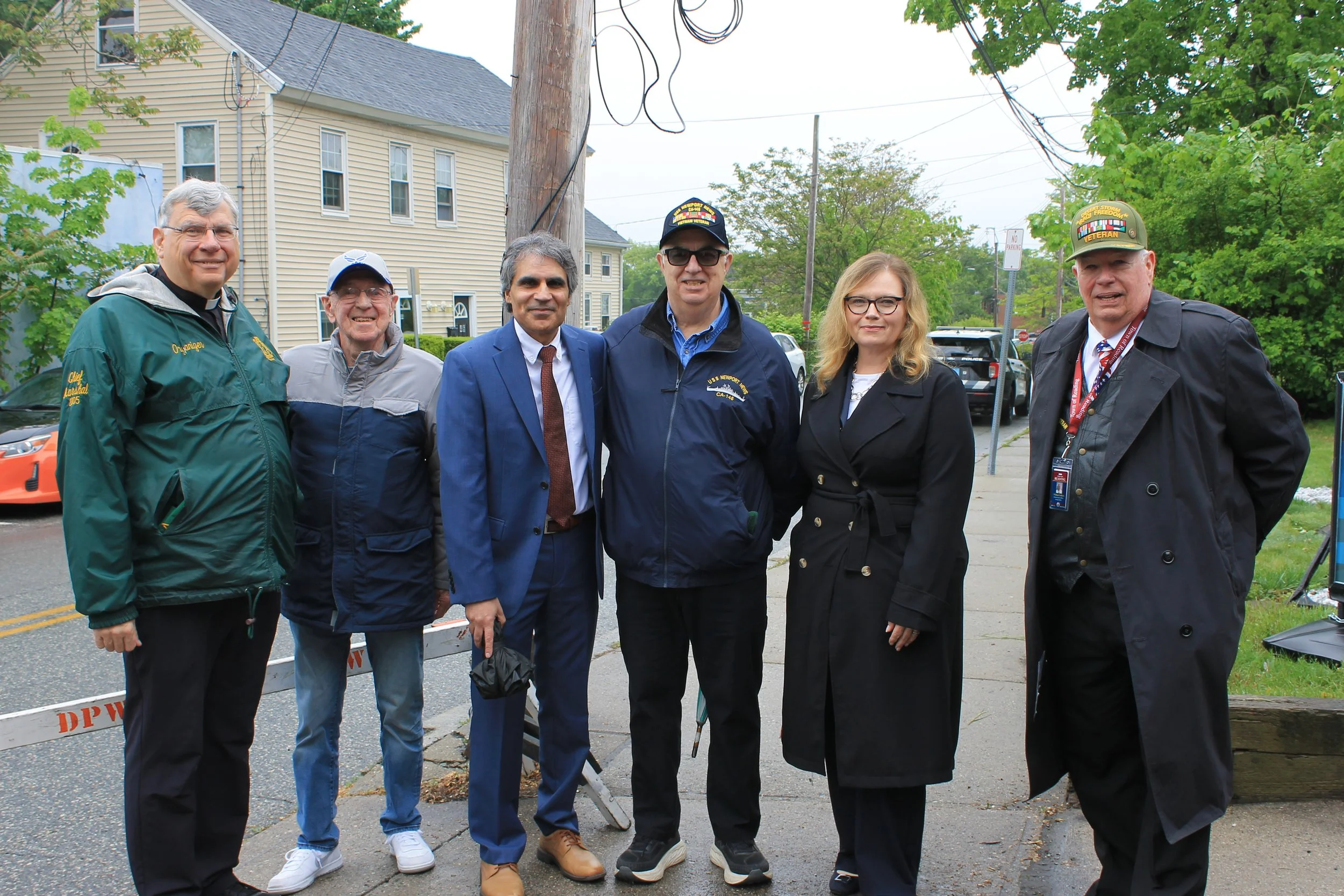 Town officials and veterans gather along the parade route ahead of the start of Reading's Memorial Day parade.