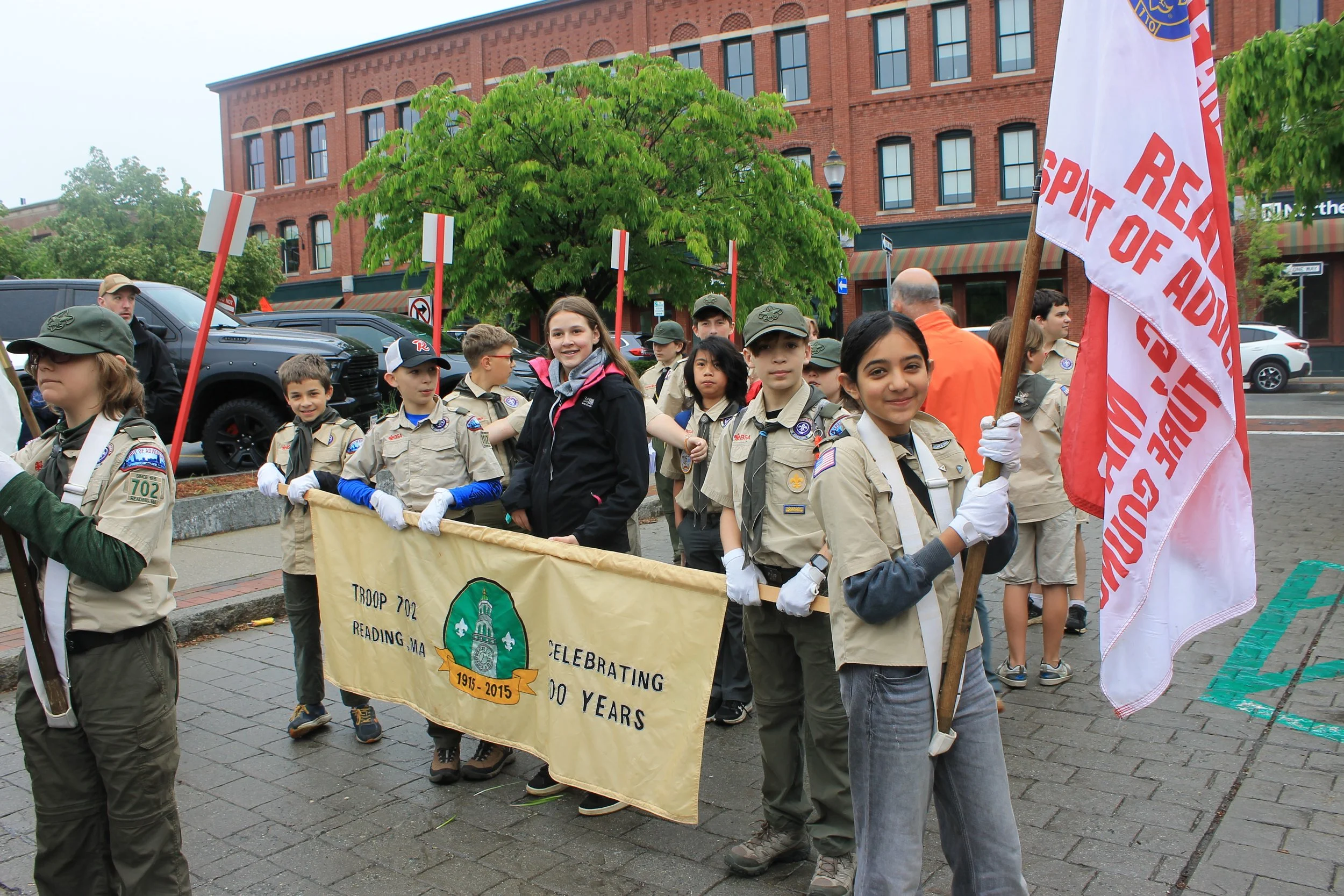 Scout Troop 702 prepares to march through downtown Reading.