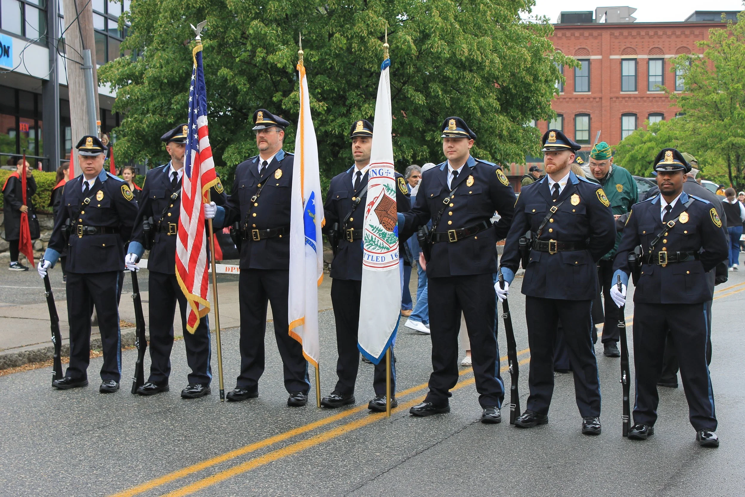 The  Reading Police Department Honor Guard leads the parade down Main Street.