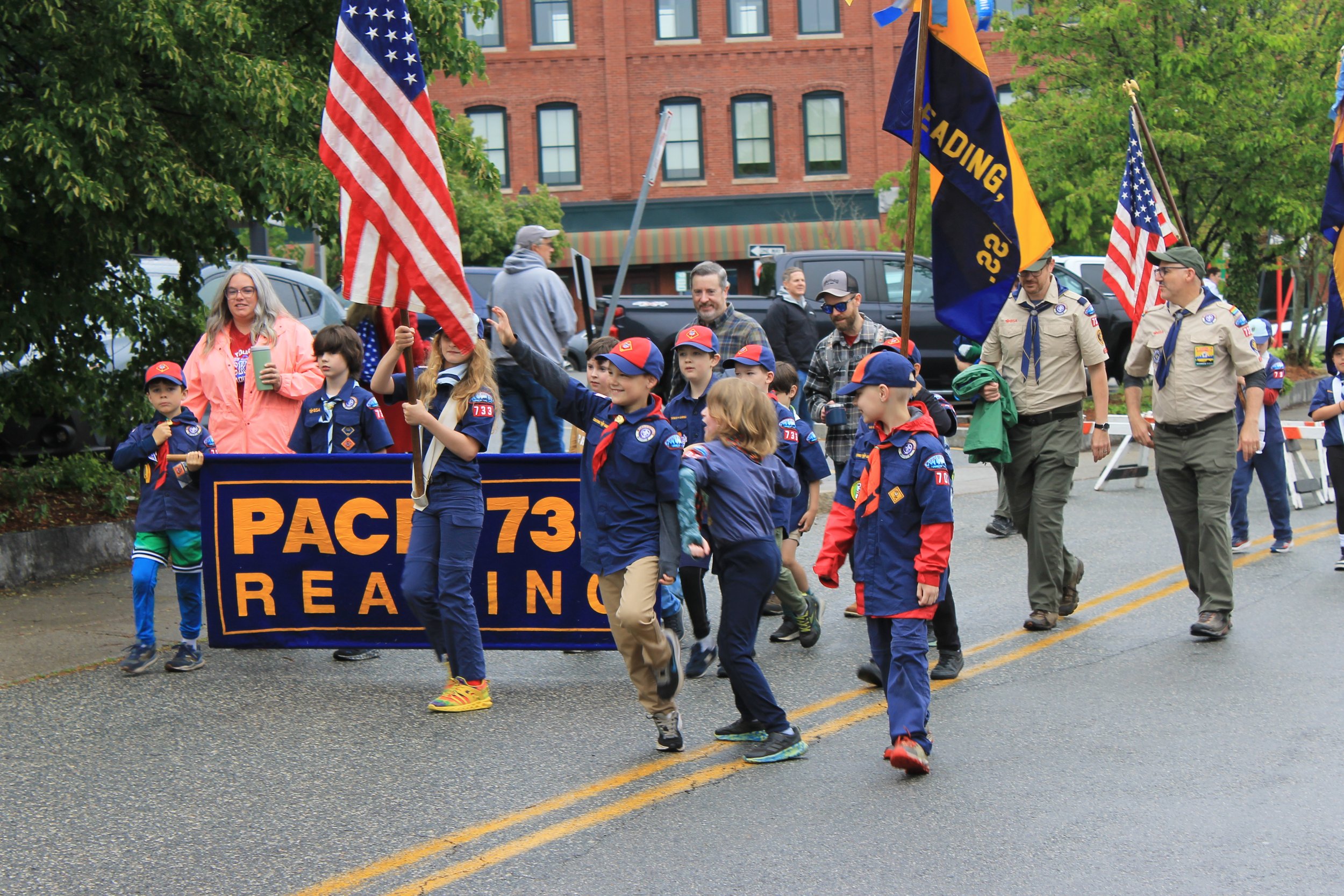 Scout Pack 733 marches up Main Street during the Memorial Day parade.