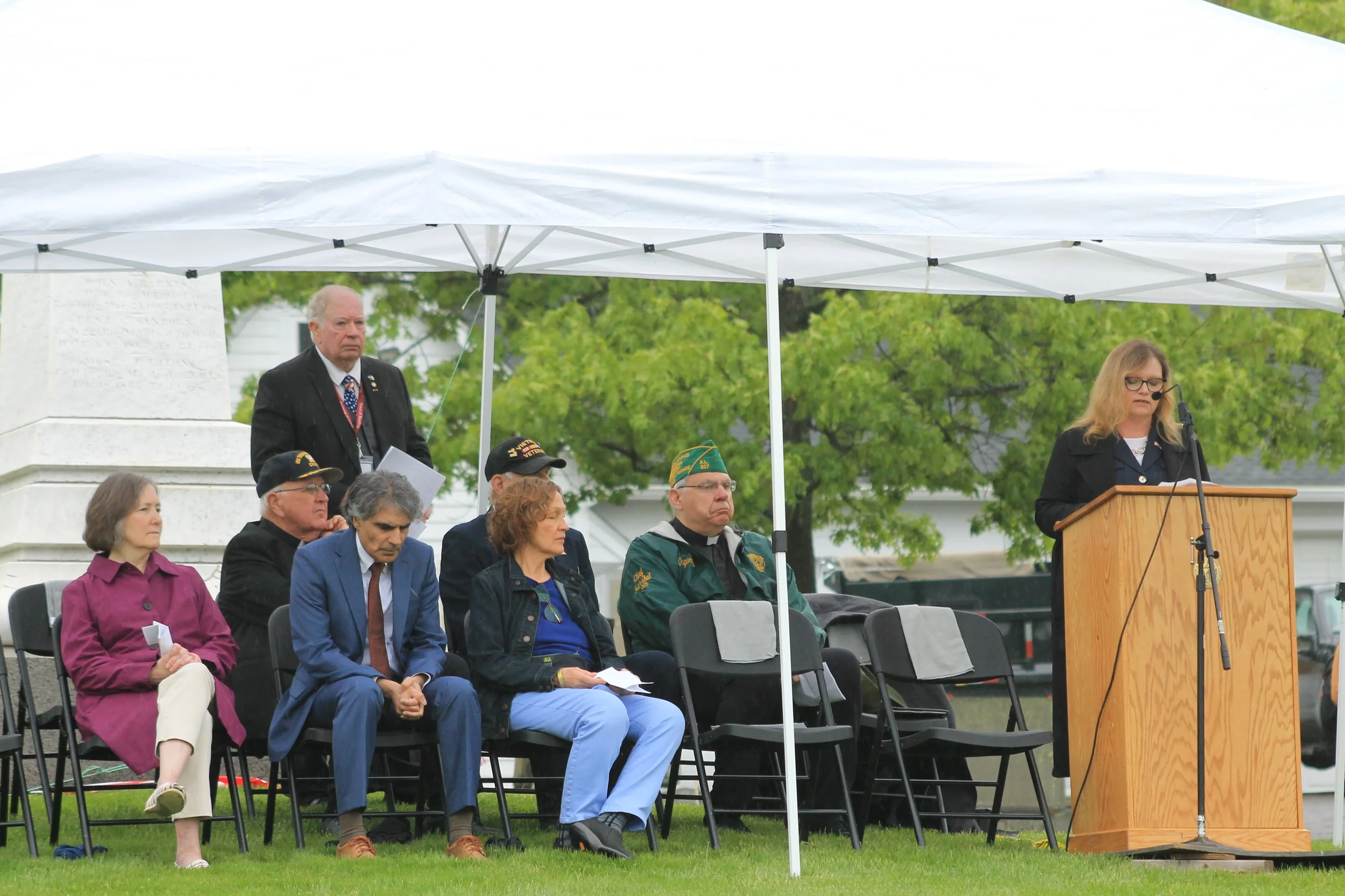 Town Manager Jayne Wellman addresses attendees at the Laurel Hill ceremony from the podium.