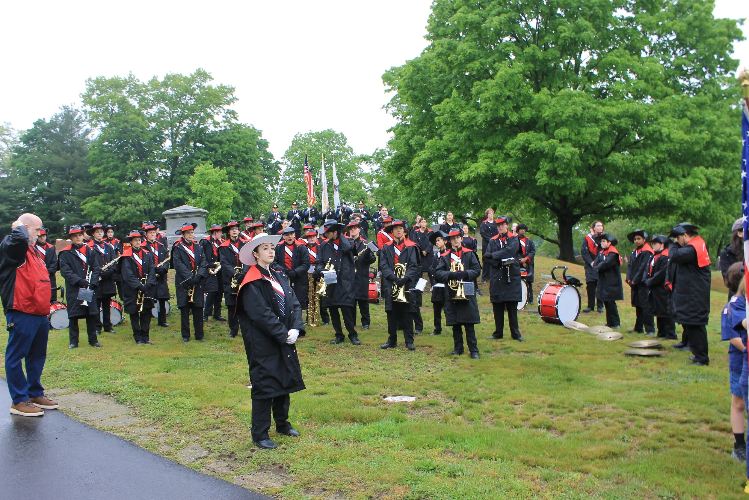 The RMHS Marching Band assemble on the grounds of Laurel Hill Cemetery as the ceremony gets underway.