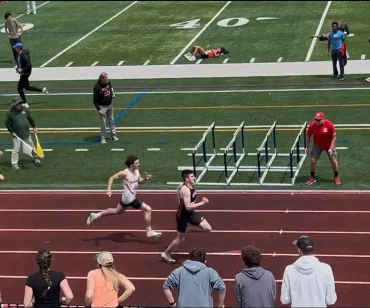 Ryan Pulpi heads down the homestretch to win the 400m