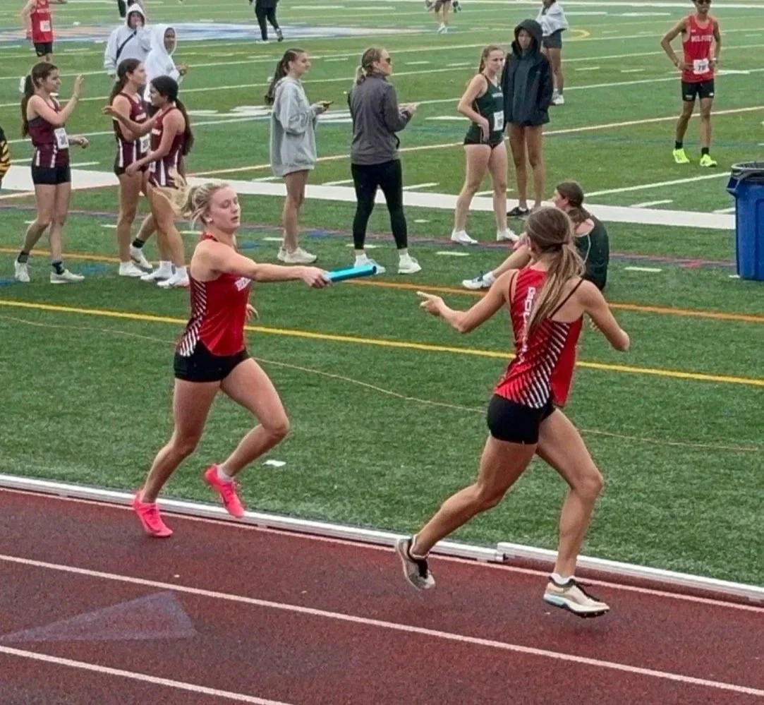 Samantha Lake hands off to Tessa Rock.