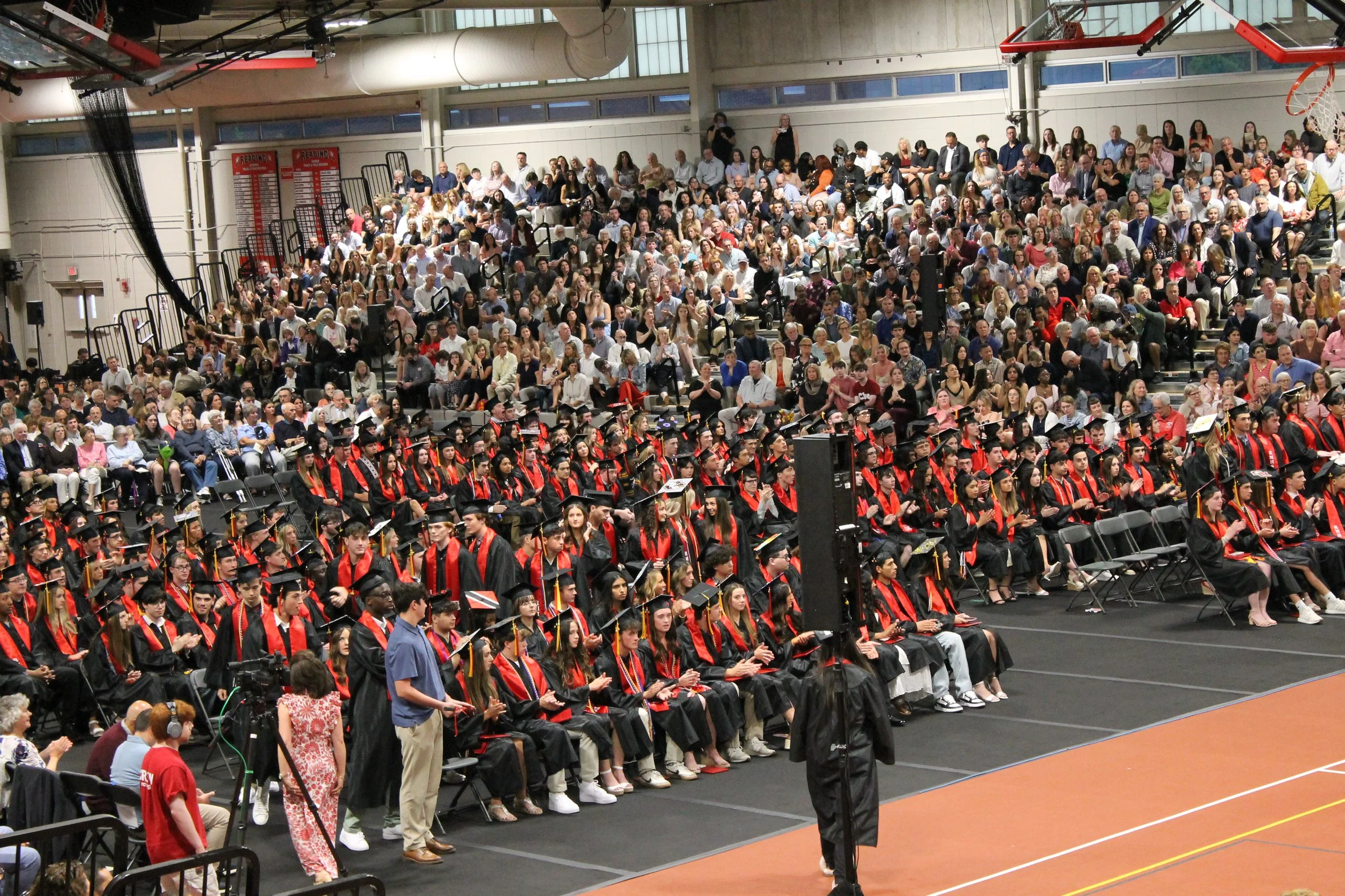 The Class of 2026 fills the floor of the Fieldhouse during the ceremony as family members look on from the stands.