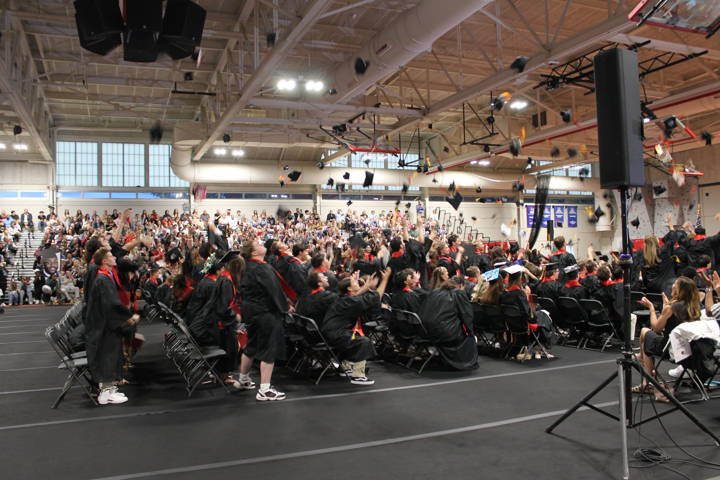 Caps fly into the air as the Class of 2026 celebrates becoming official graduates of Reading Memorial High School.