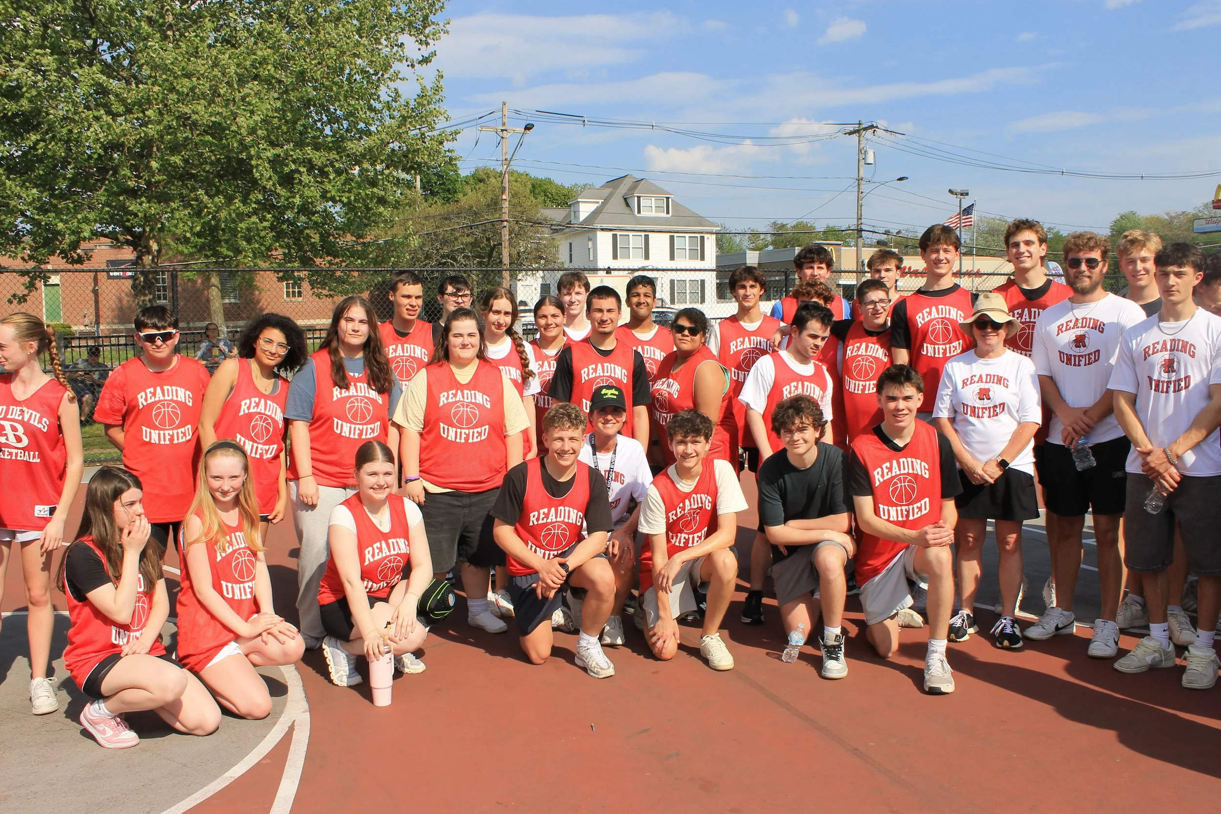 The Reading Unified team poses together  on the outdoor courts at Galvin Middle School.