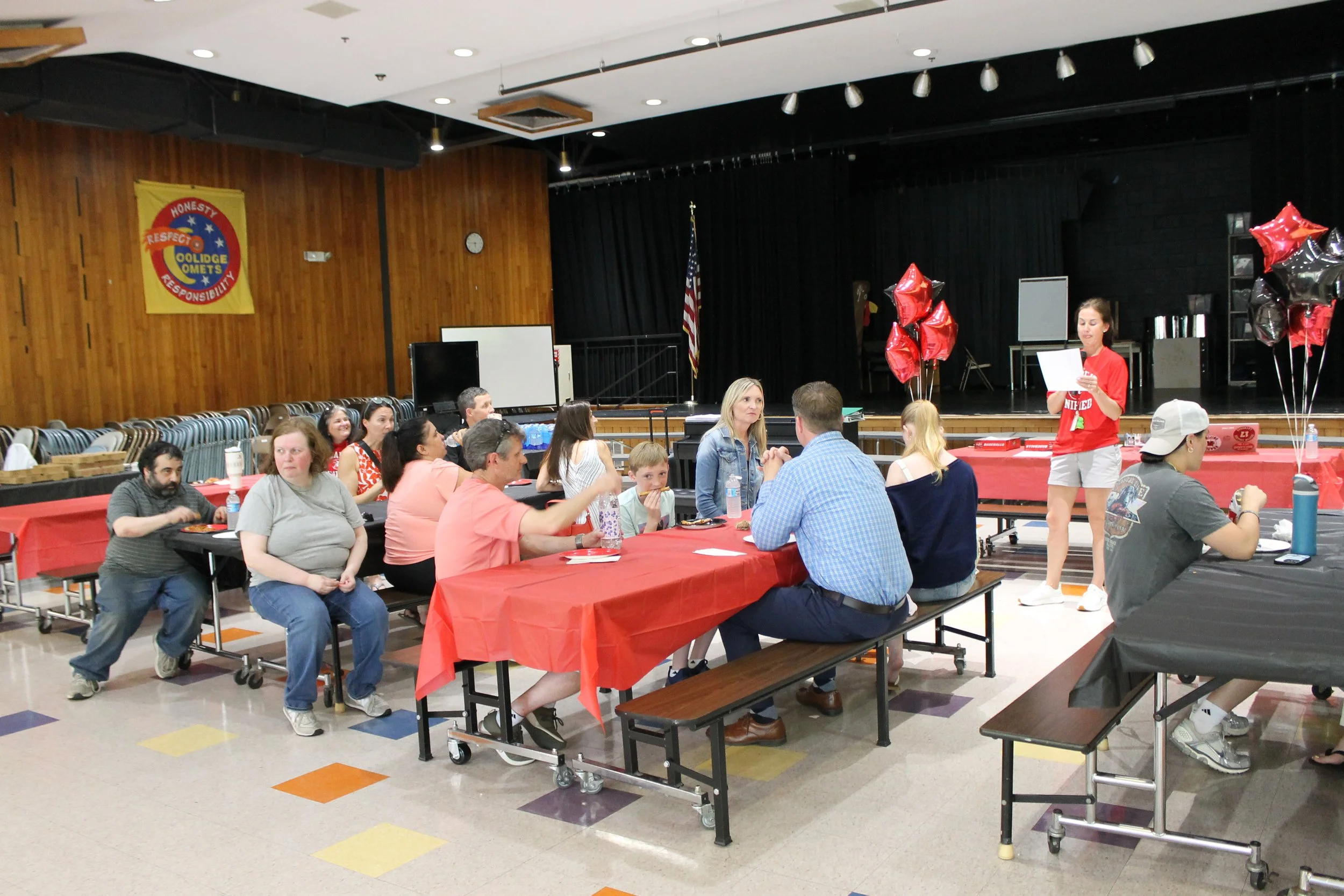 Families and athletes gather around tables at the Coolidge Middle School cafeteria for the banquet.
