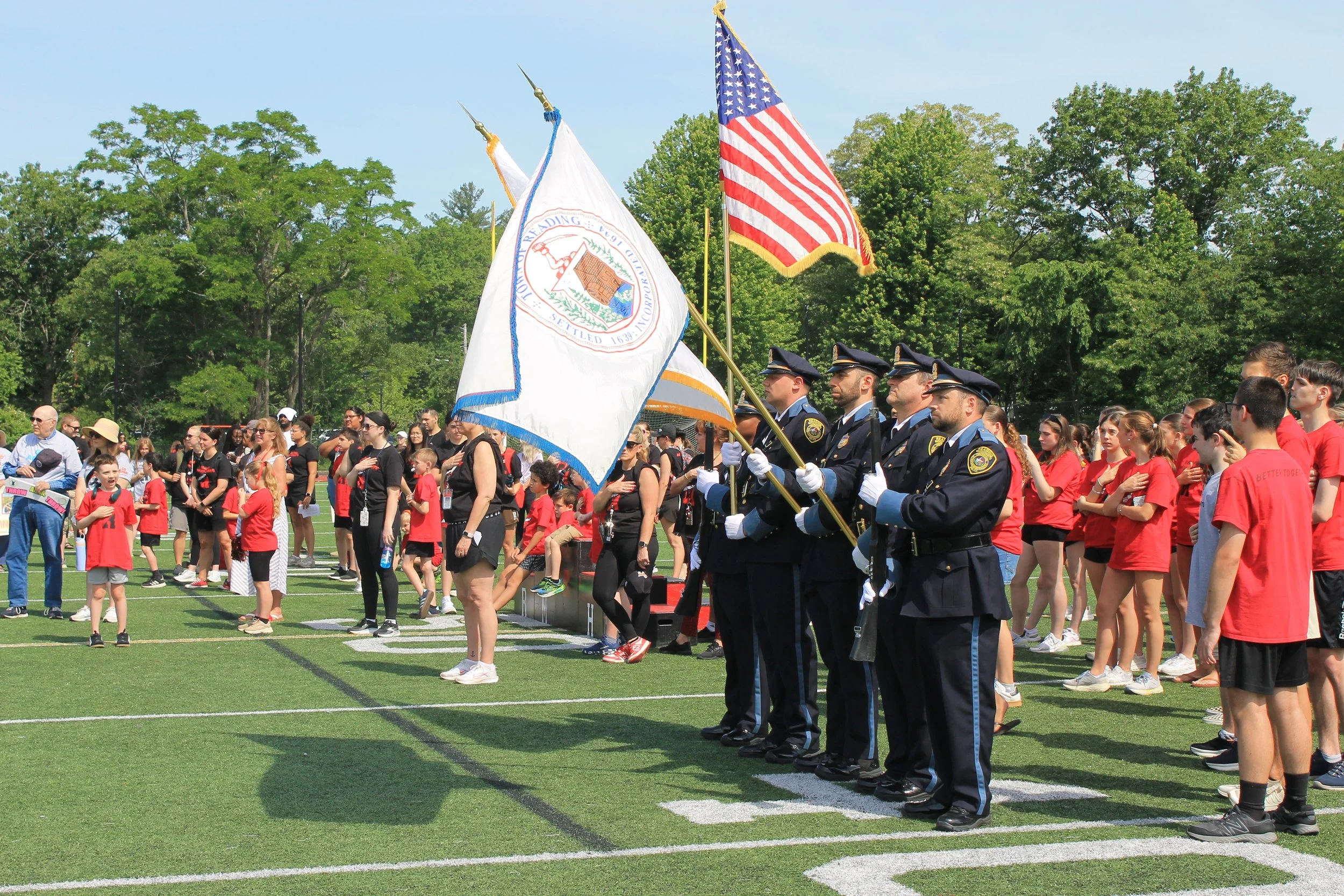 The Reading Police Department Honor Guard presents the colors during the National Anthem.