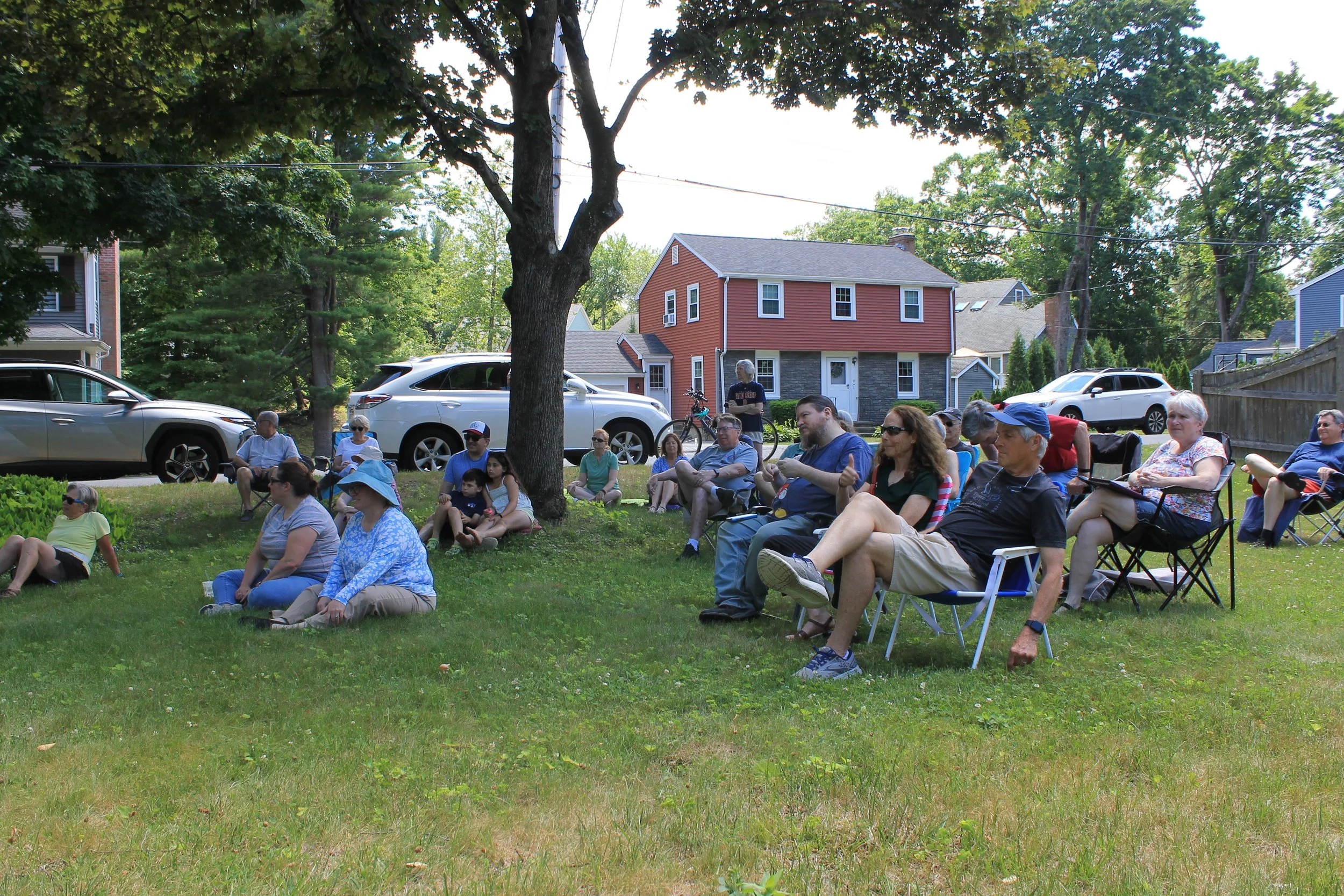 Residents gather on the lawn of 24 Linnea Lane for a Porchfest stop.