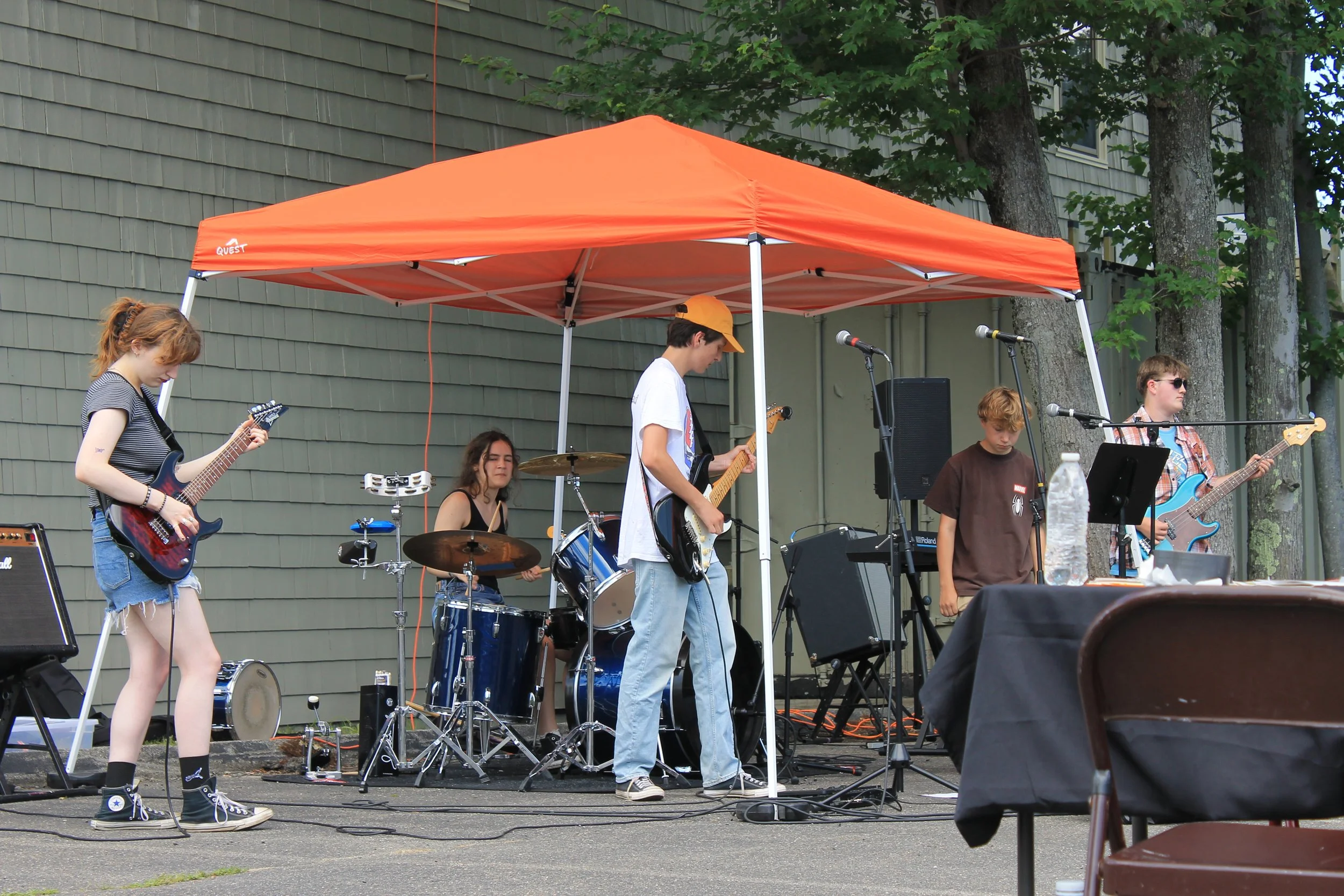 Beantown Music rocks out under their tent at 67 Pondmeadow Drive.