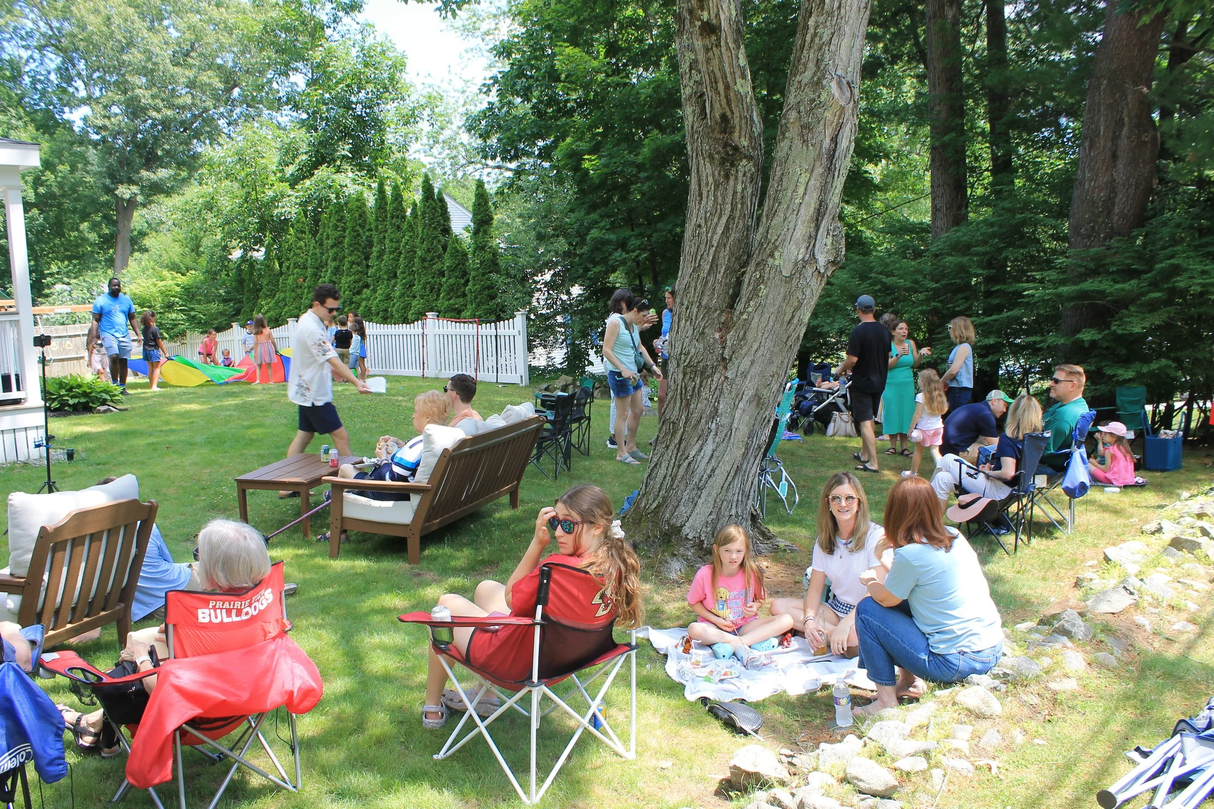 A porch performance by Sounds Like Chicken draws a crowd of lawn chairs.