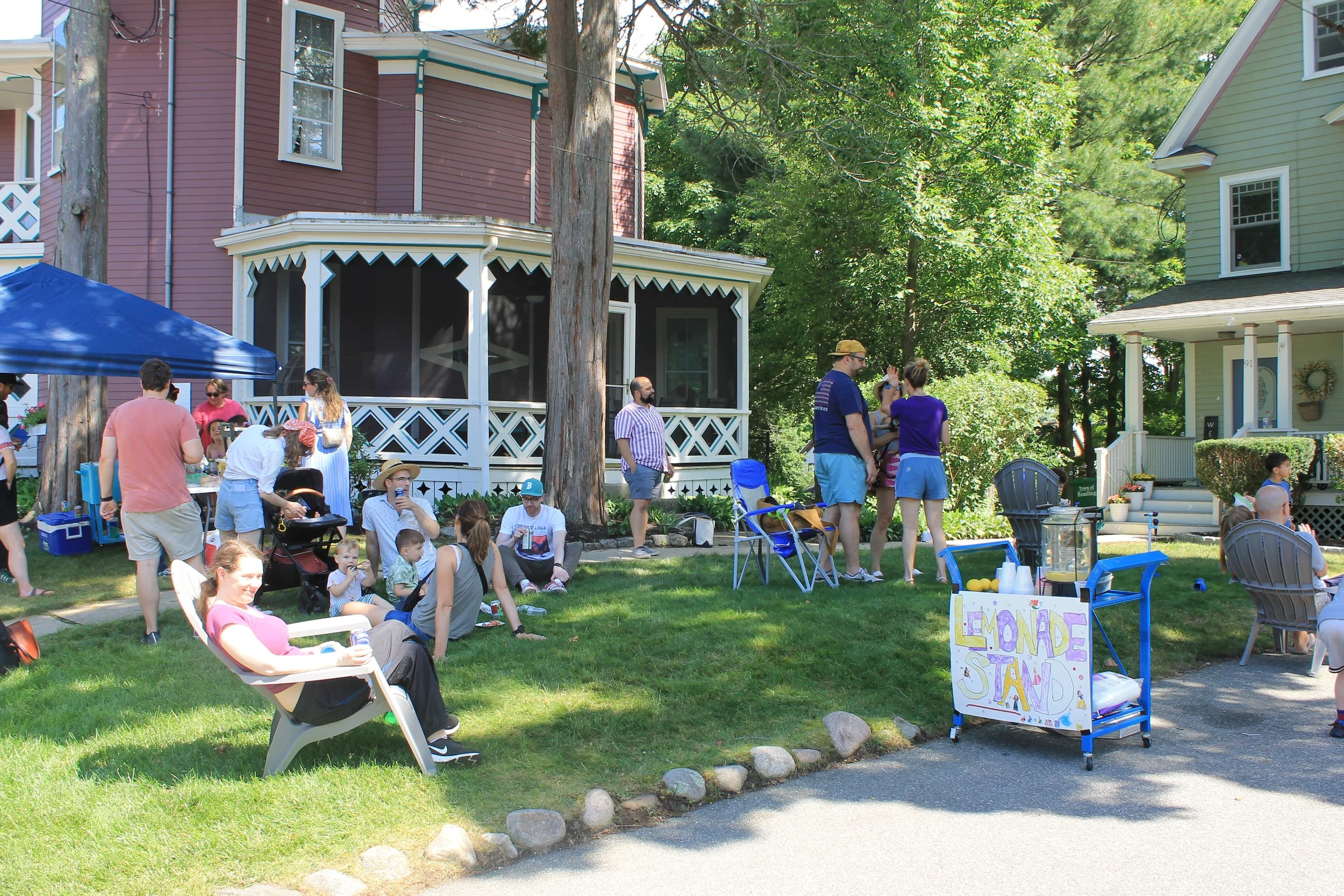 Neighbors mingle and enjoy the lemonade stand at 91 Pleasant Street.