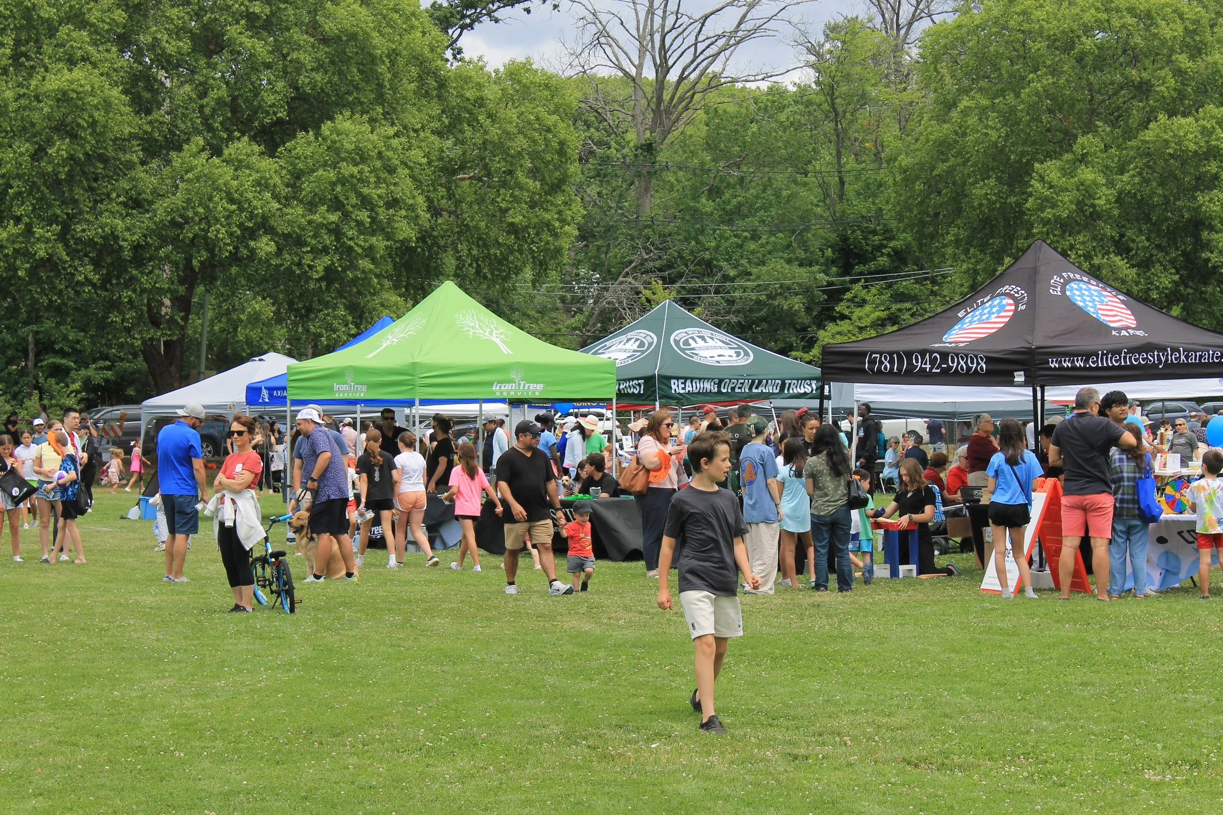 Community organizations and local businesses line the field at the Birch Meadow Field Complex.