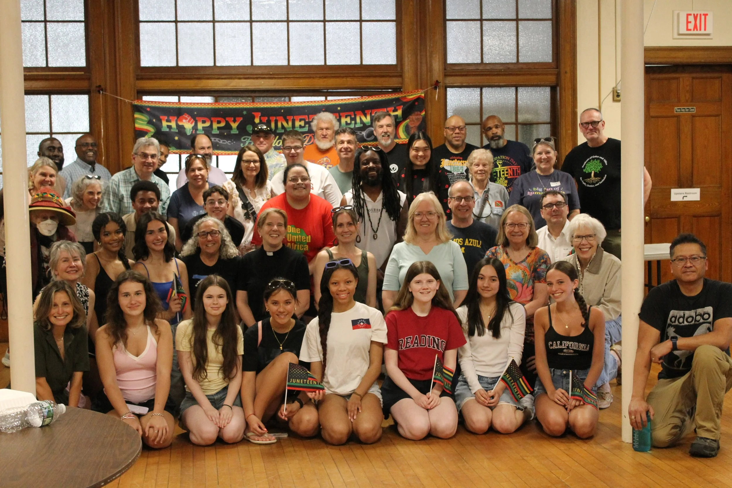 Community members gathered for a group photo after the educational seminar.