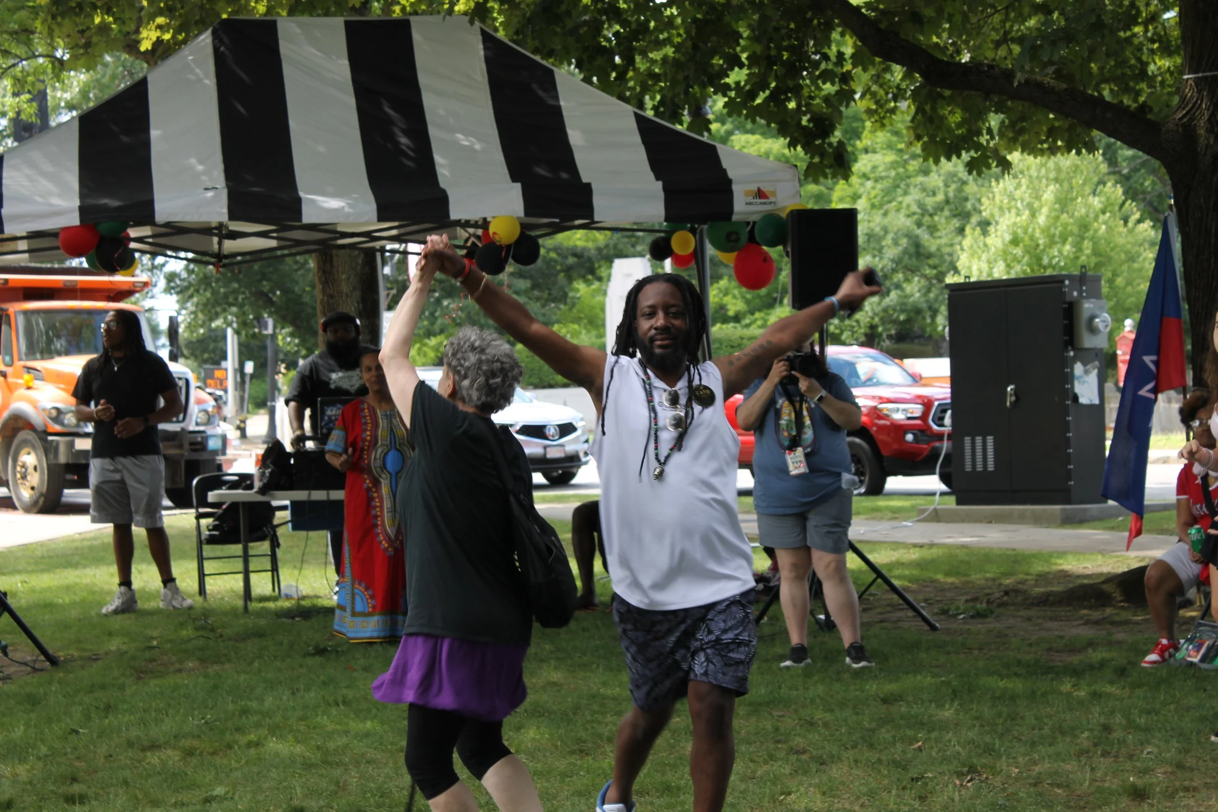 Two attendees twirled through a dance as the music played on.