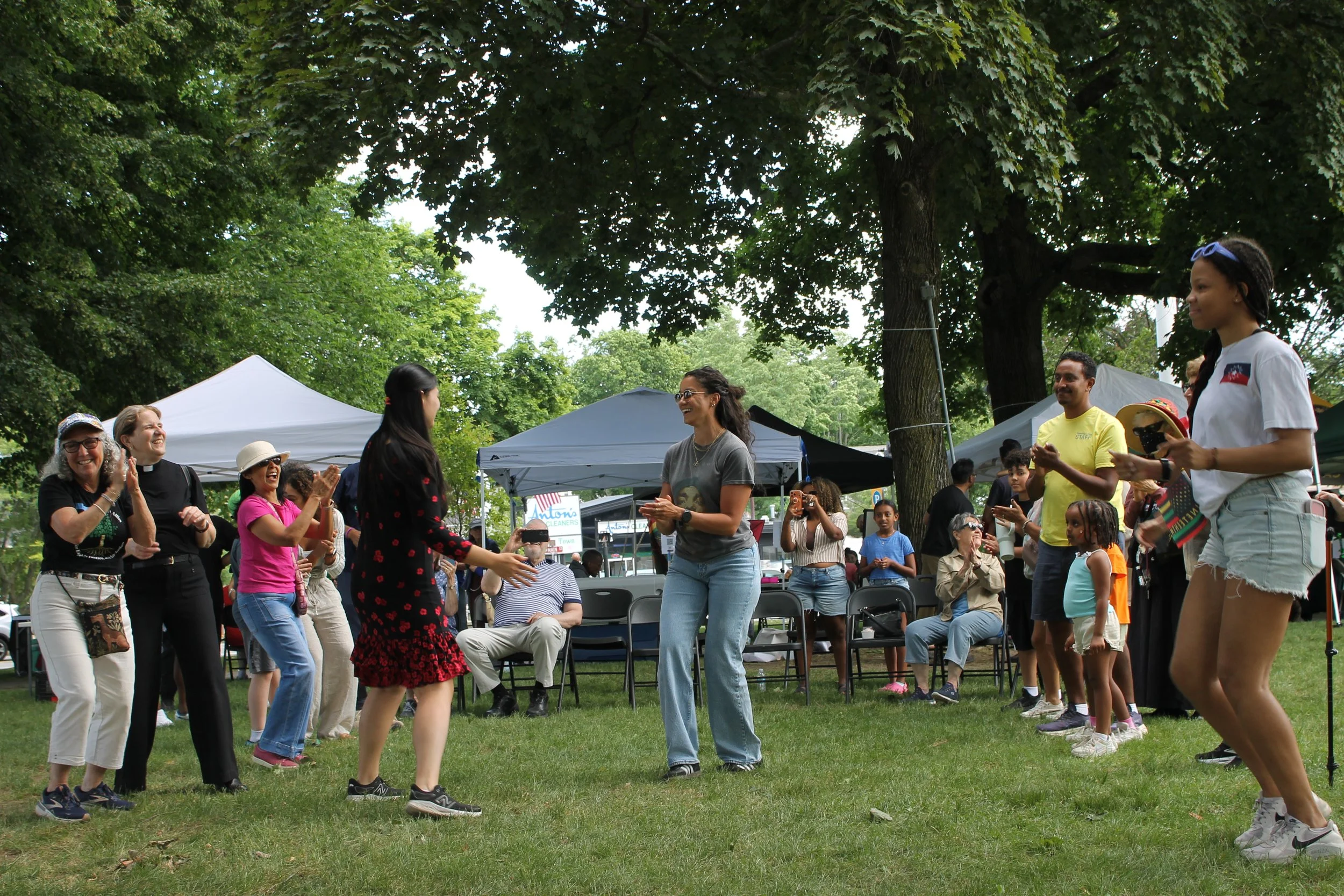 The crowd cheered and clapped along as dancers took the grass, drawing people of all ages into the celebration.